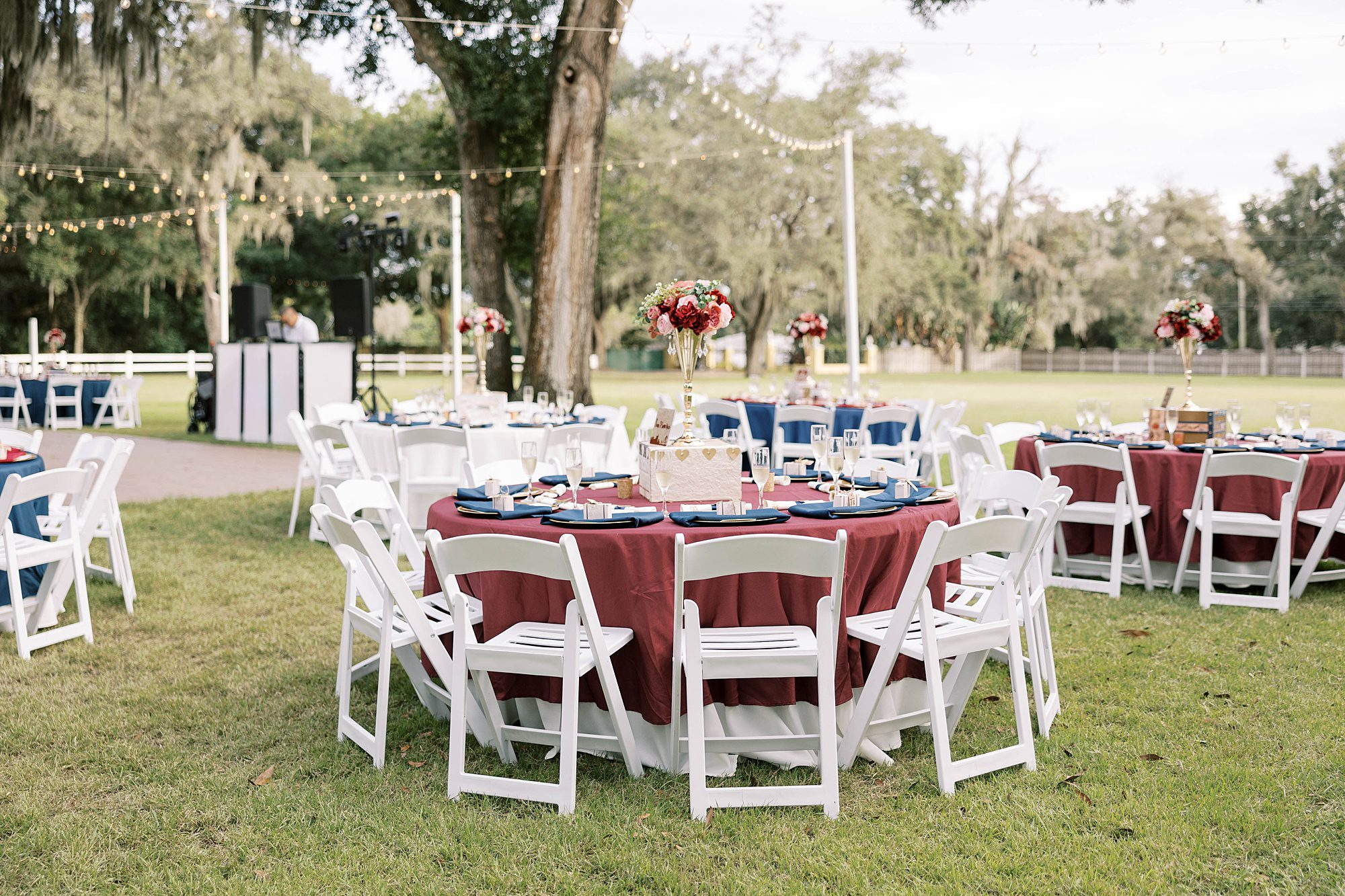 wedding reception table with burgundy table cloth