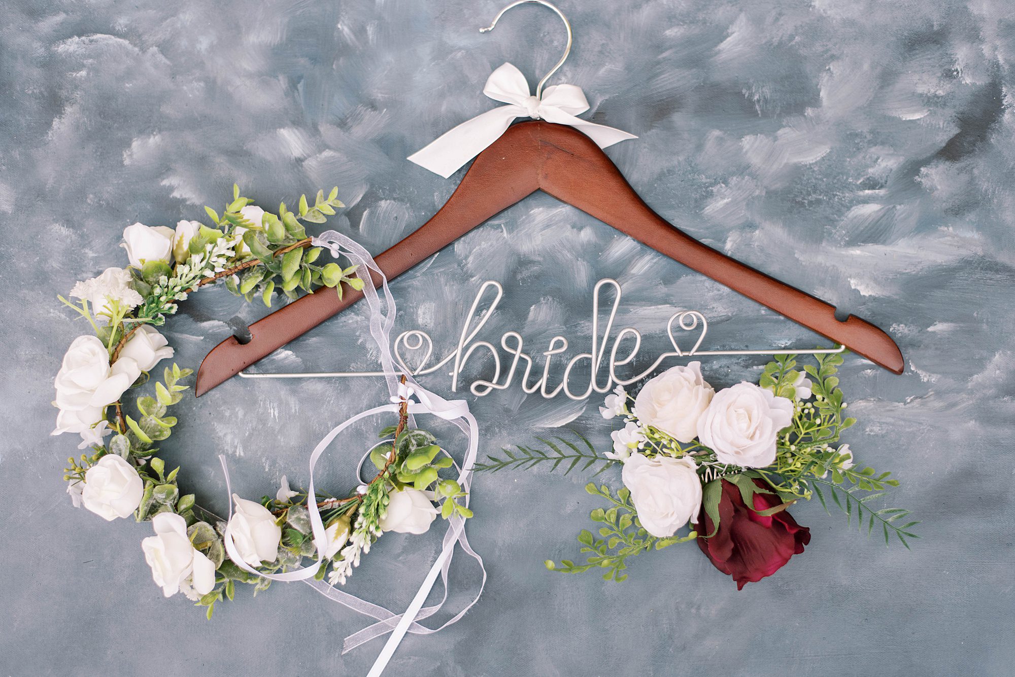 bride's custom wedding dress hanger on blue velvet