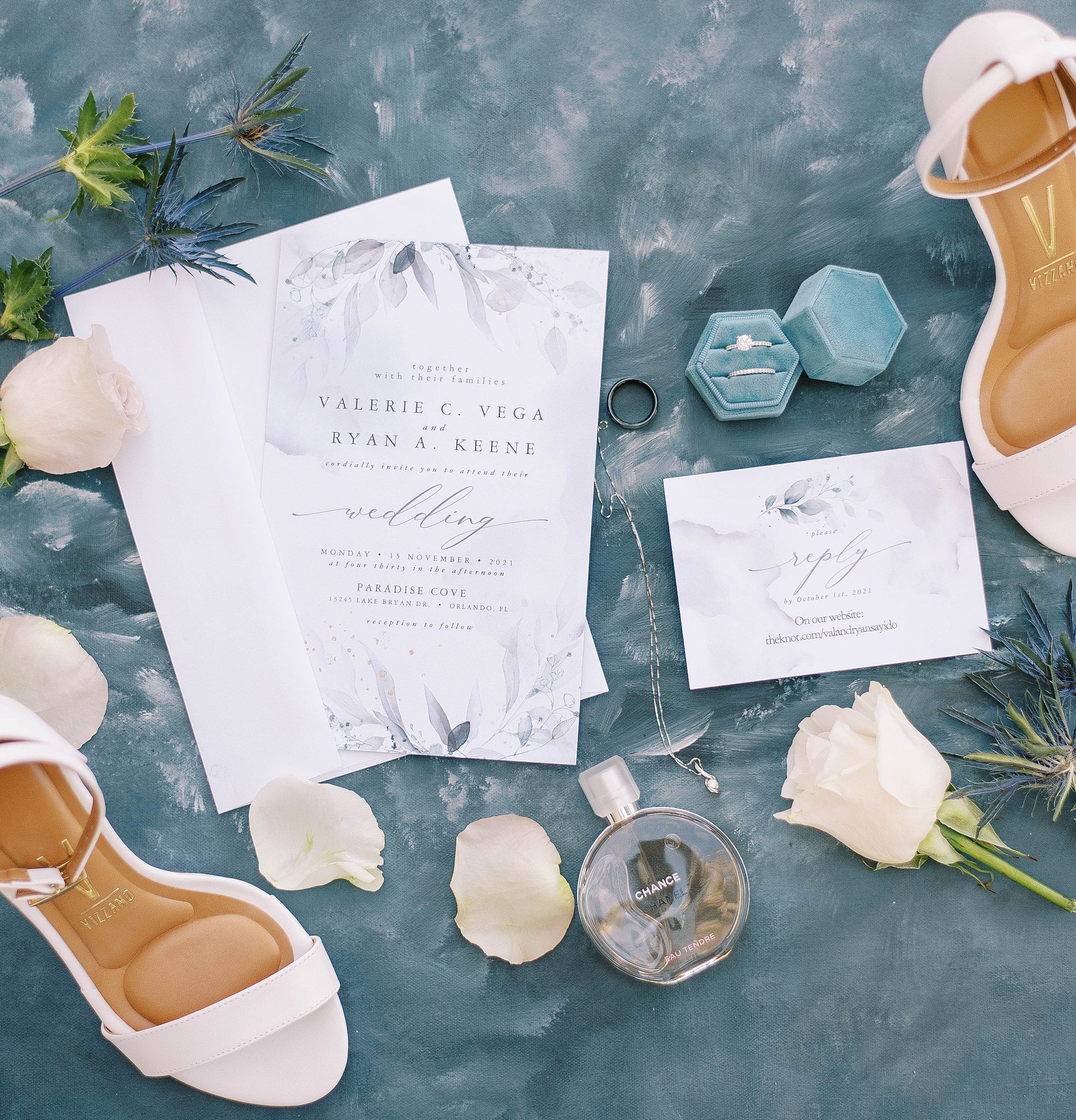 invitation suite and shoes on blue suede drop for Florida wedding