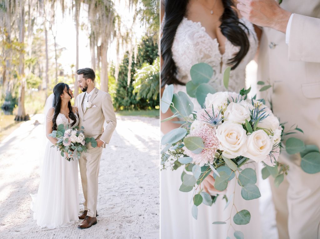 bride holds bouquet of ivory roses and greenery leave on beach in Orlando