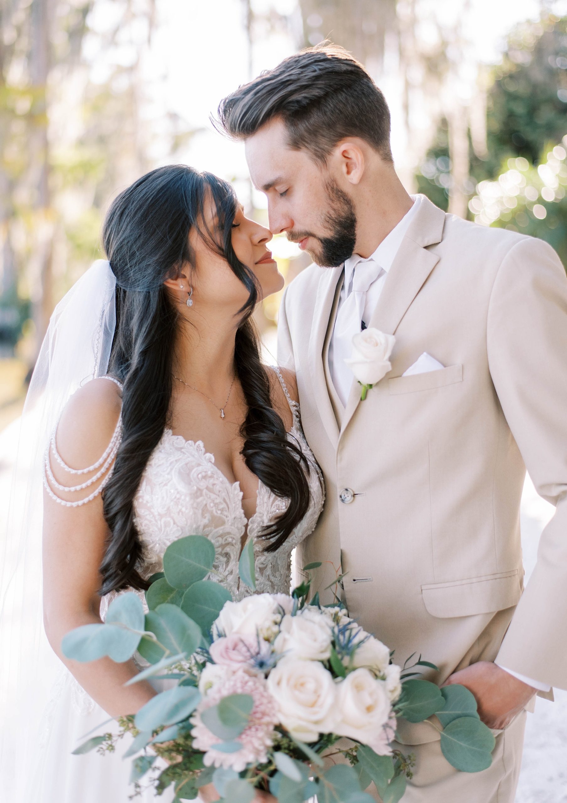 newlyweds stand with noses touching during Orlando wedding photos