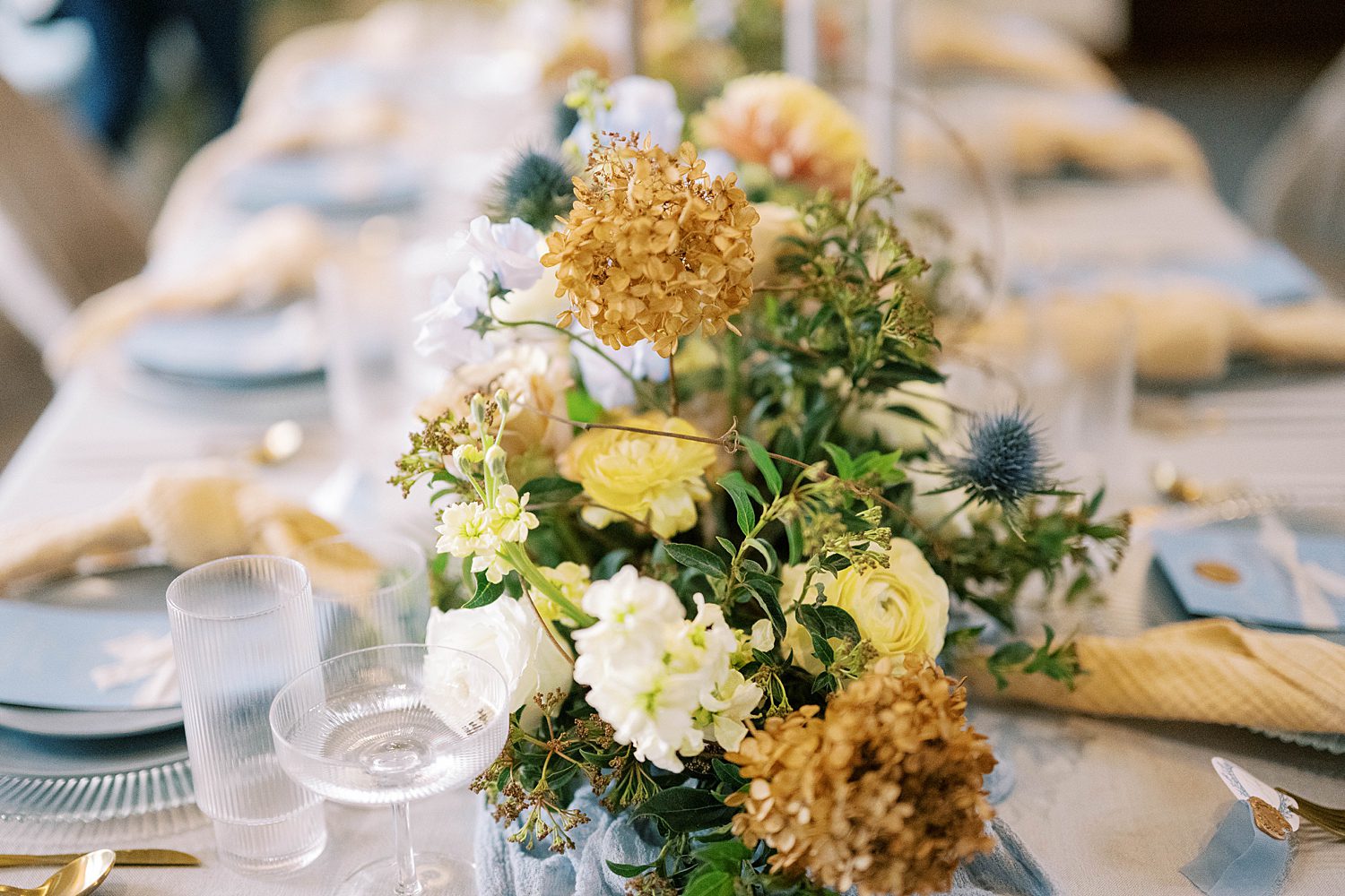 yellow and gold floral display for table runner