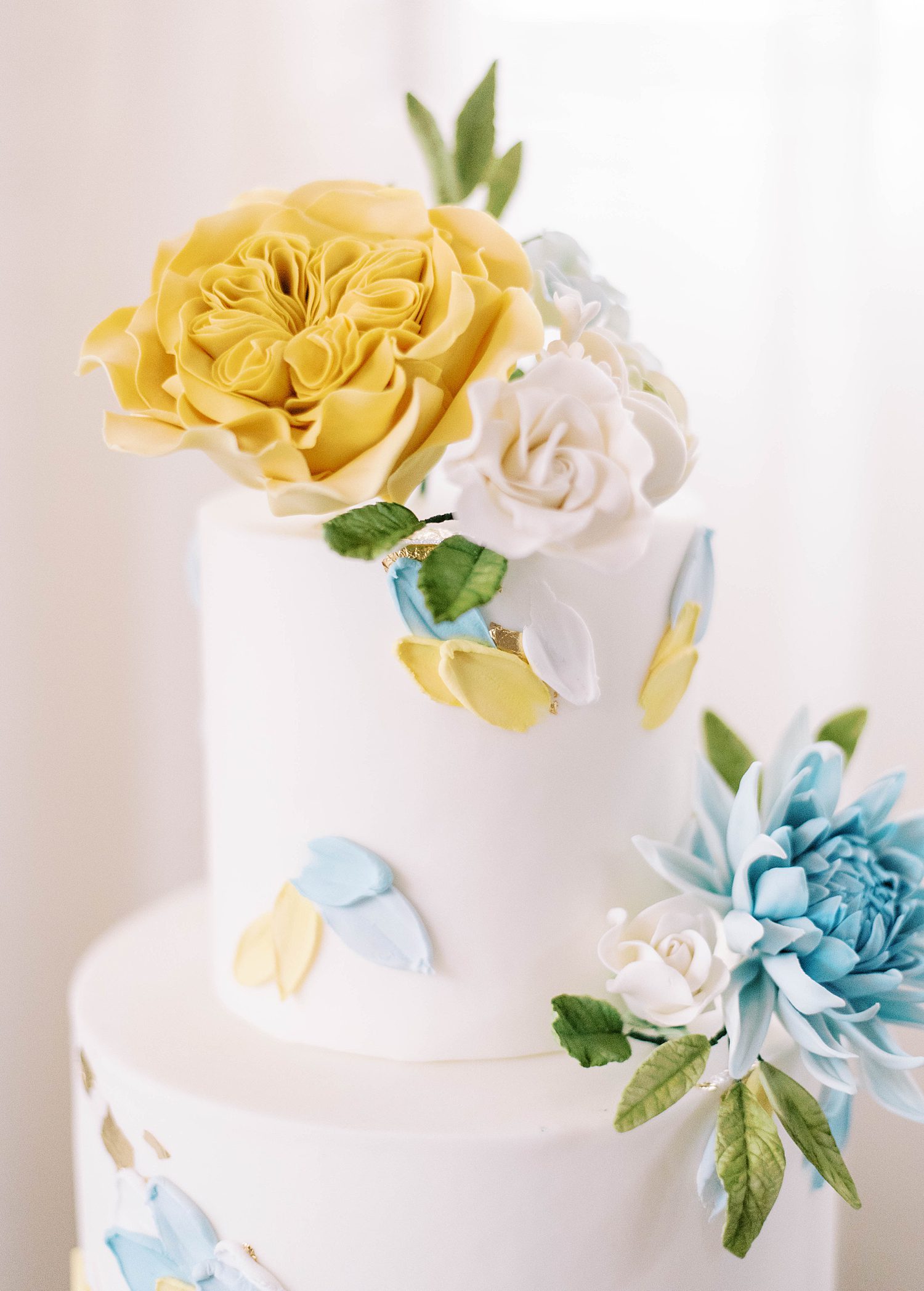 floral accents on top of wedding cake