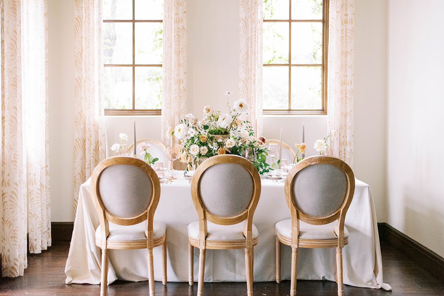 intimate wedding reception with simple floral centerpiece
