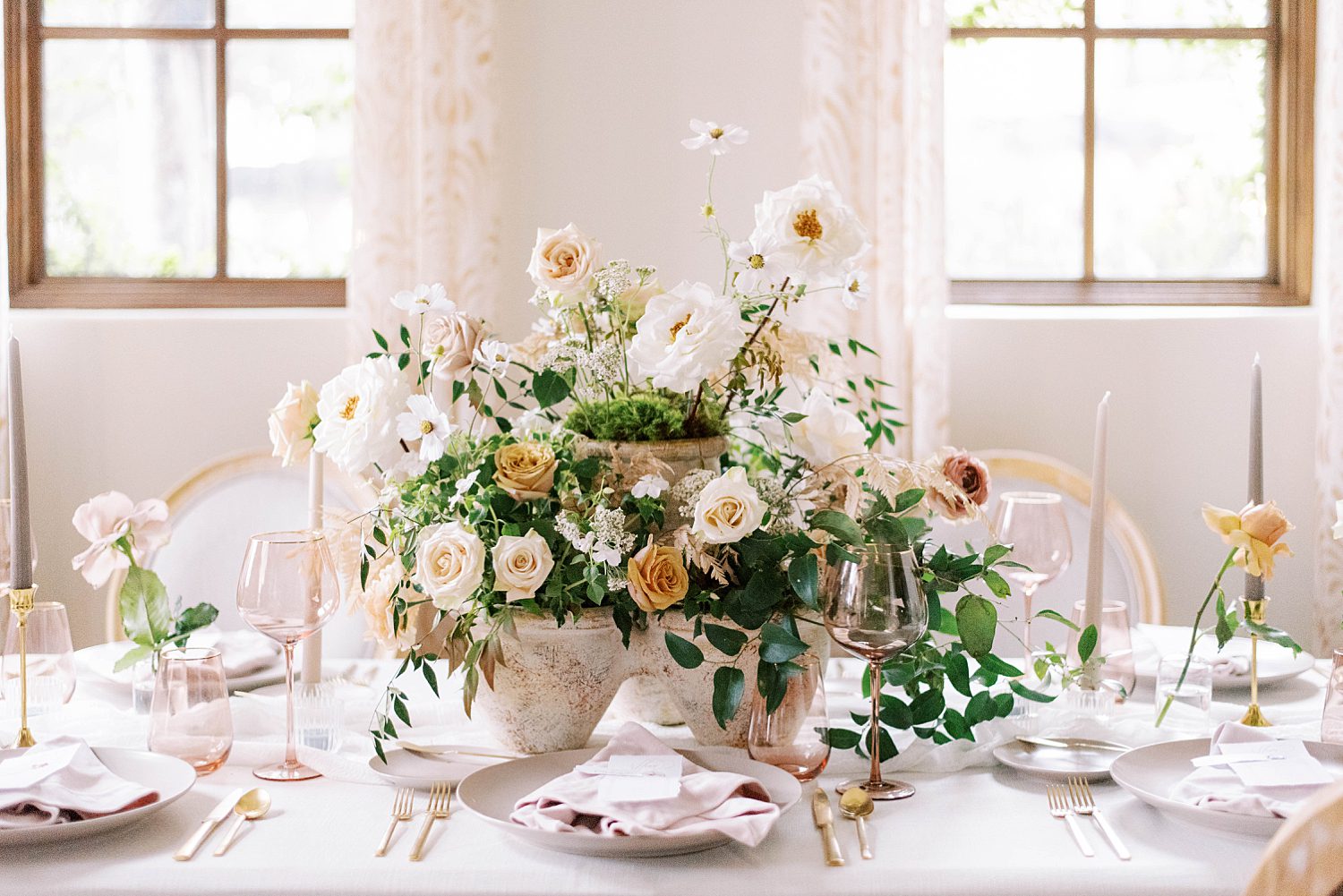 floral centerpiece with tall muted flowers