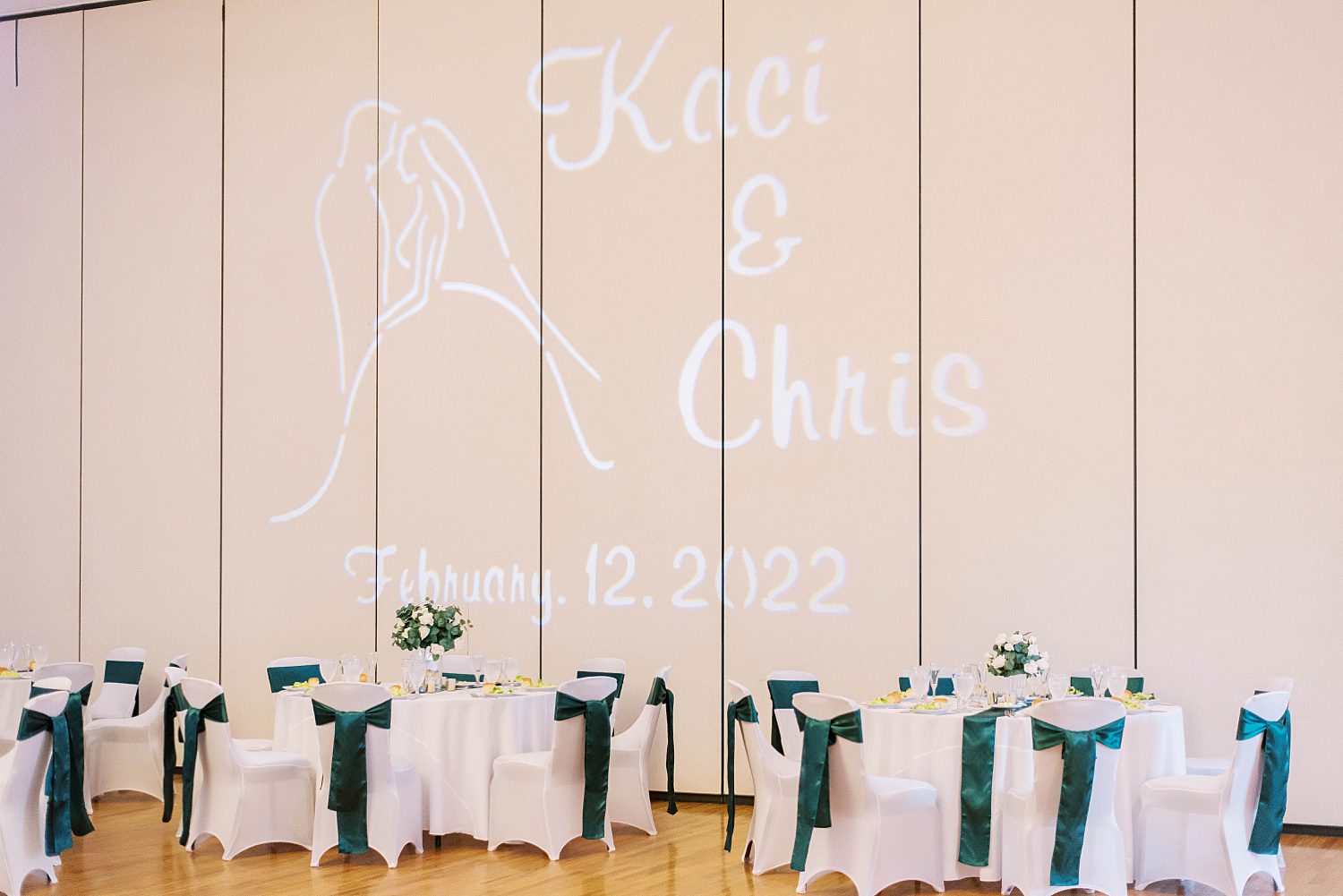 The Regent wedding reception with ivory and emerald green details