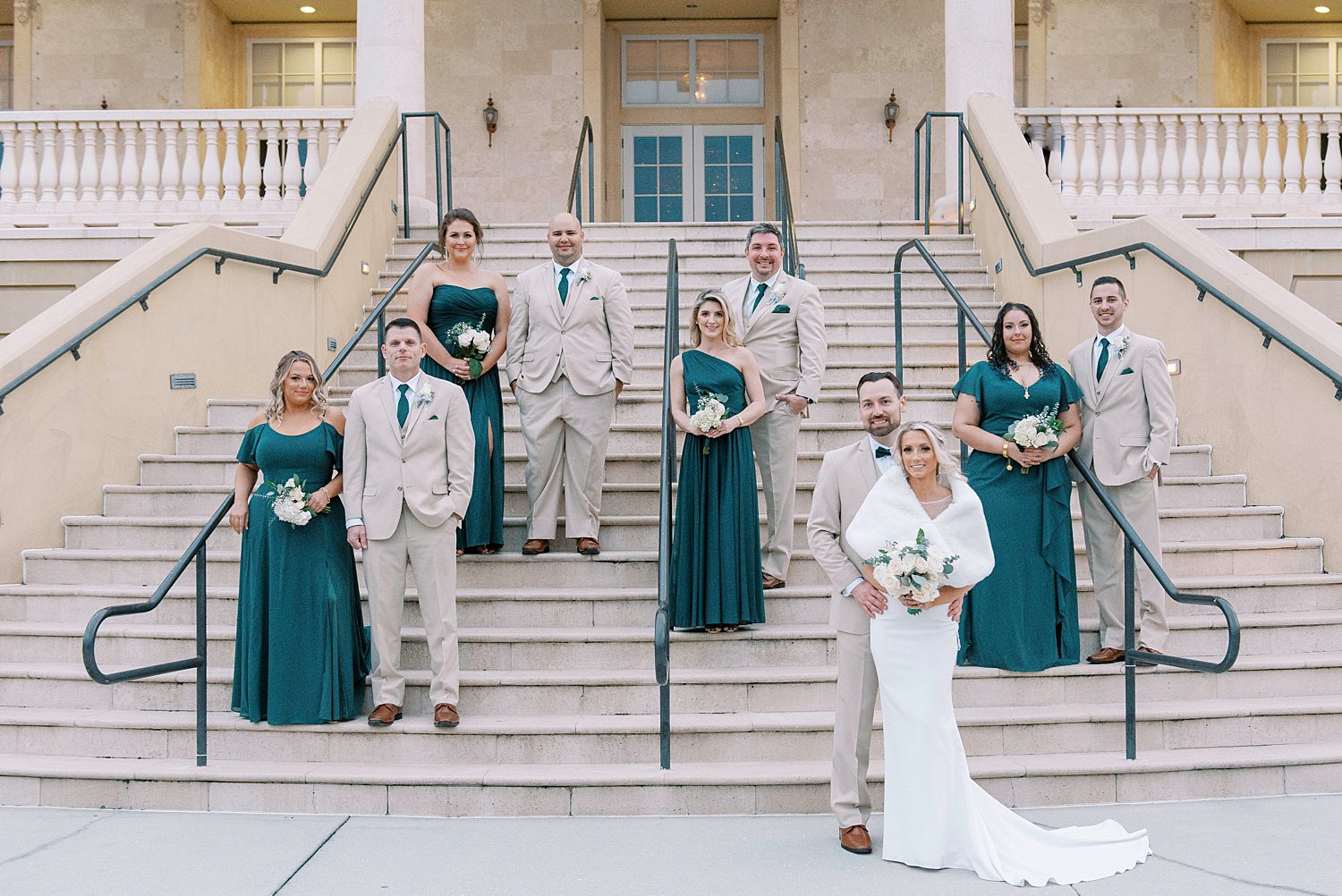 bride and groom pose with wedding party during The Regent wedding portraits