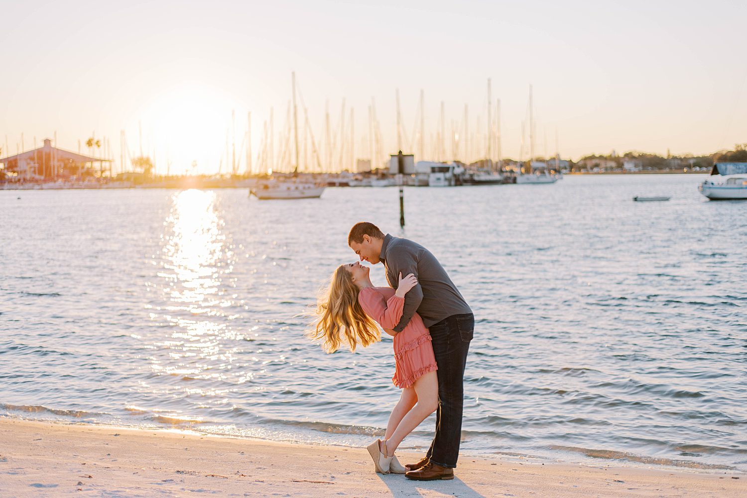 bride and groom almost kiss at sunset during Davis Island engagement session