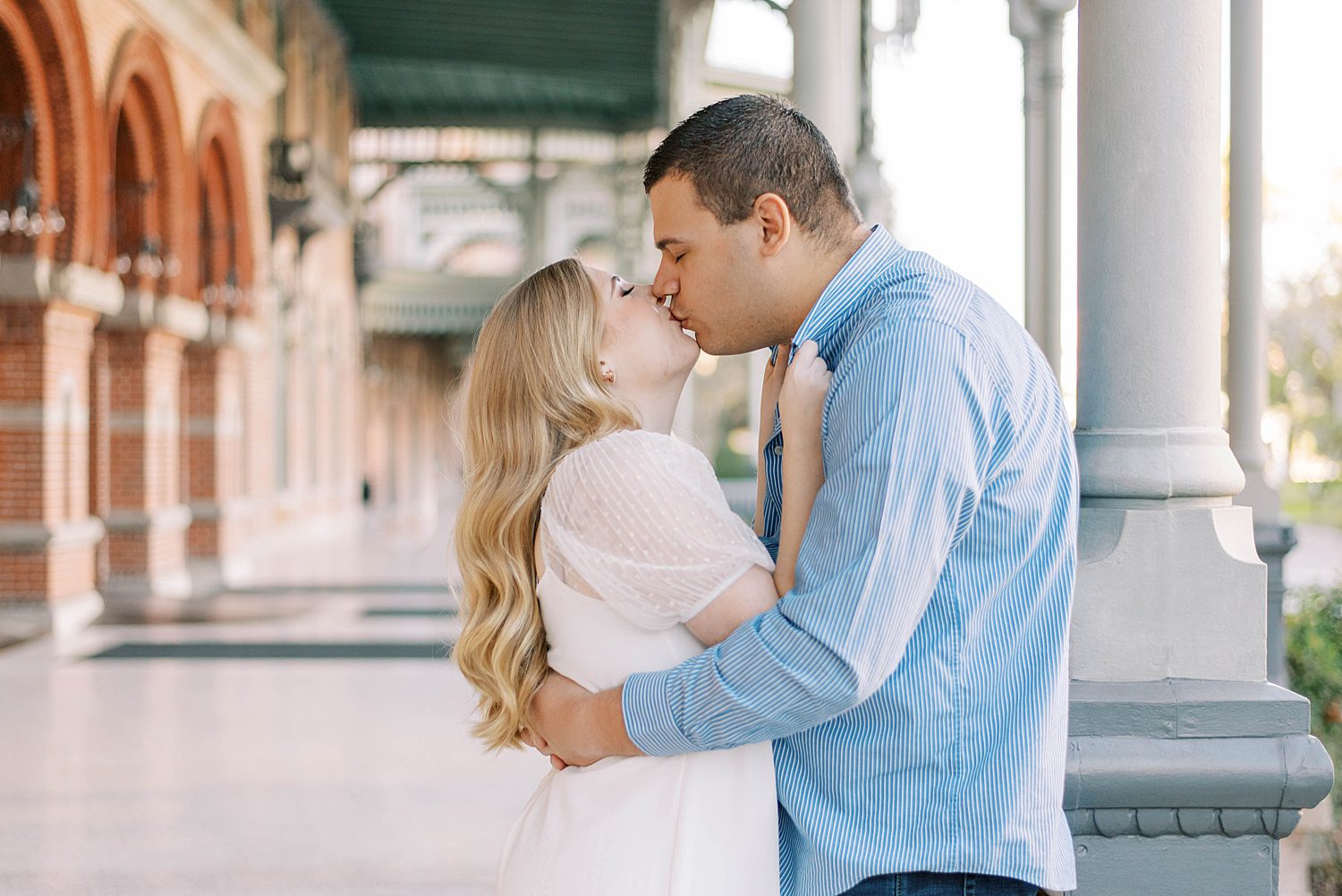 bride and groom kiss during Tampa FL engagement photos