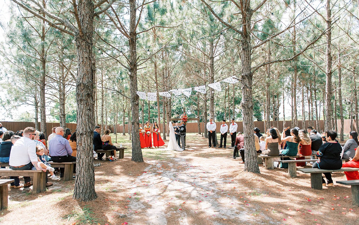 couple exchanges vows in clearing at The Barn at Lone Oak Acres