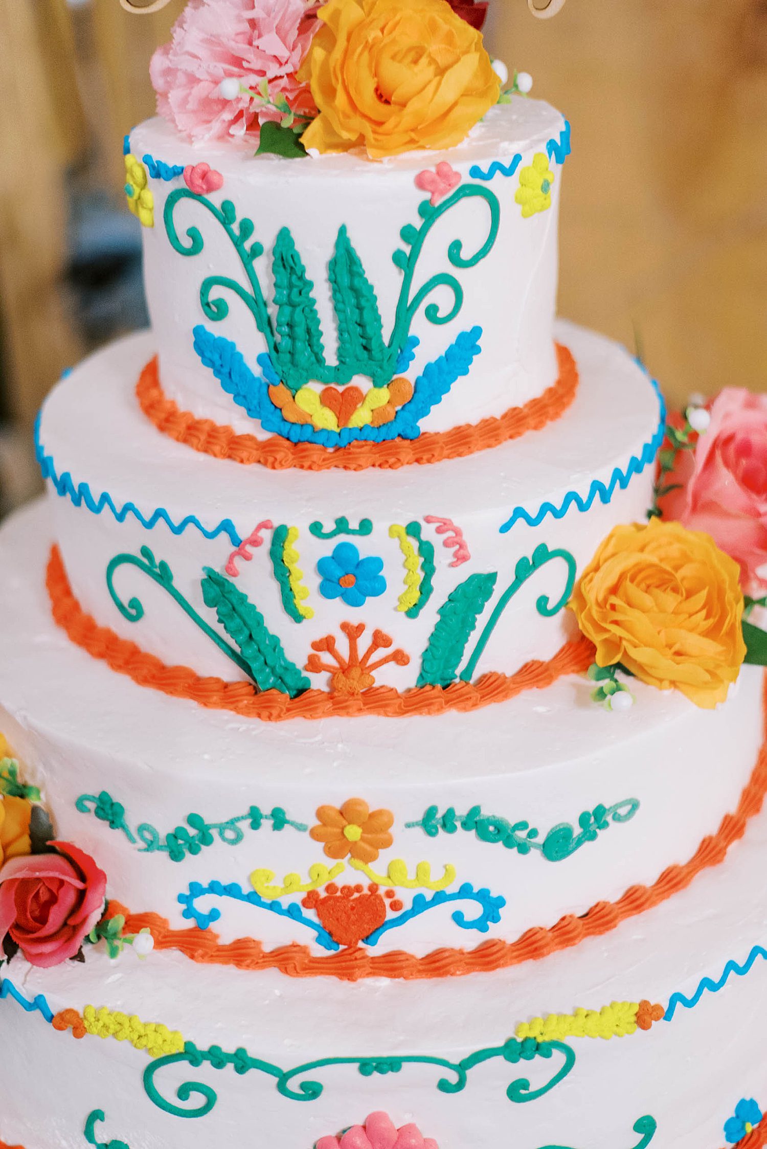 custom wedding cake with bright colors and traditional Mexican designs