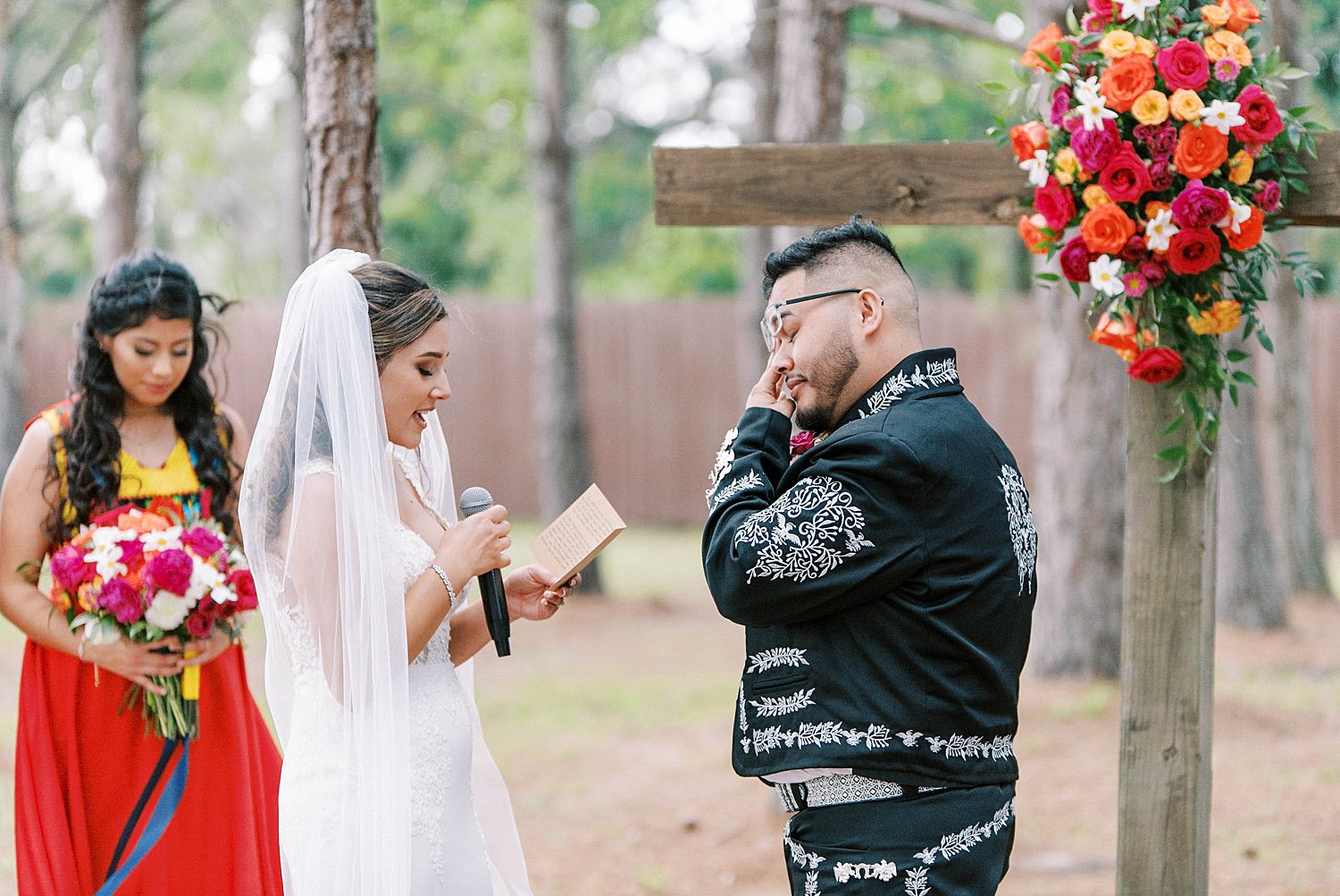 groom cries during wedding ceremony at The Barn at Lone Oak Acres