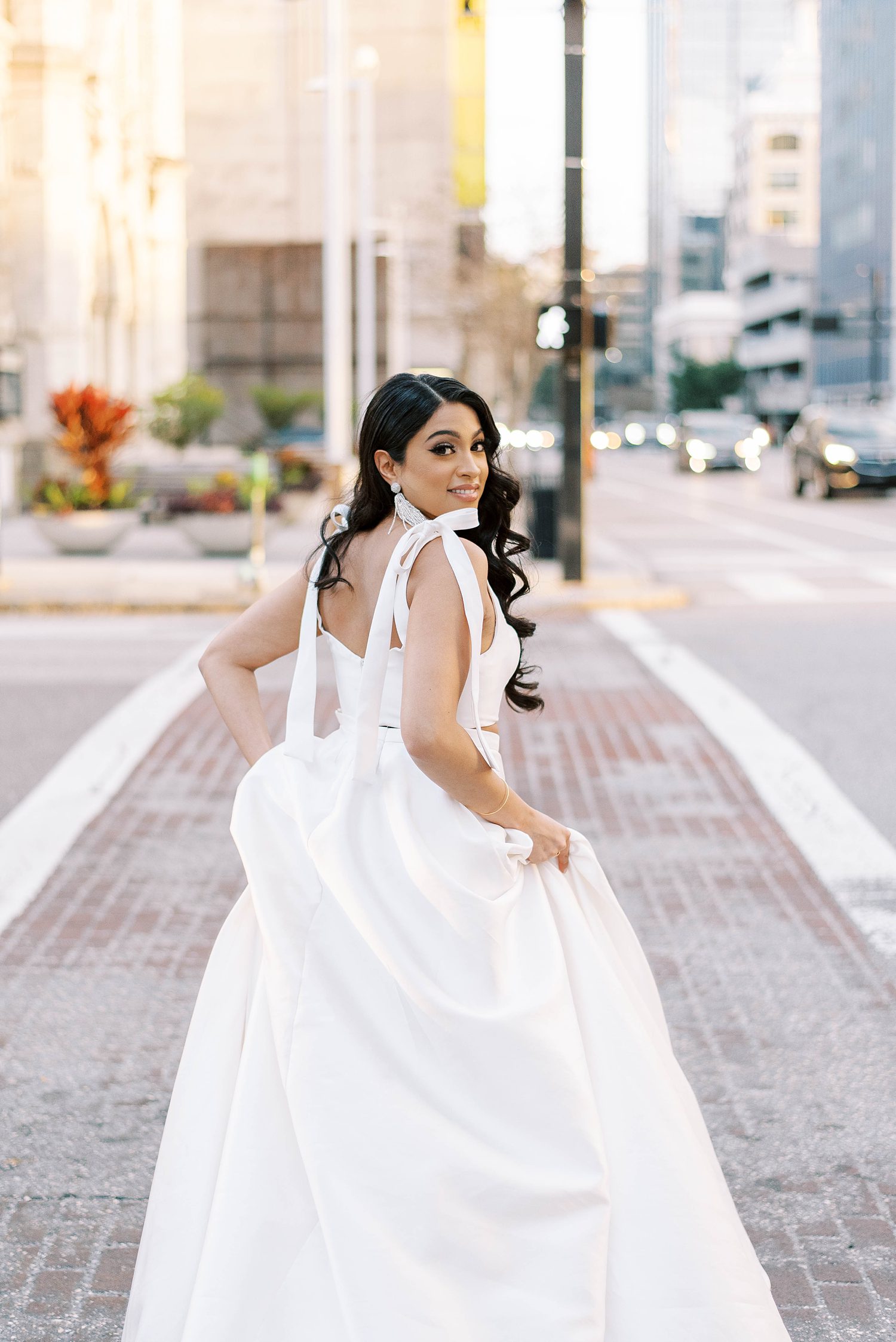 bride runs through street in downtown Tampa 
