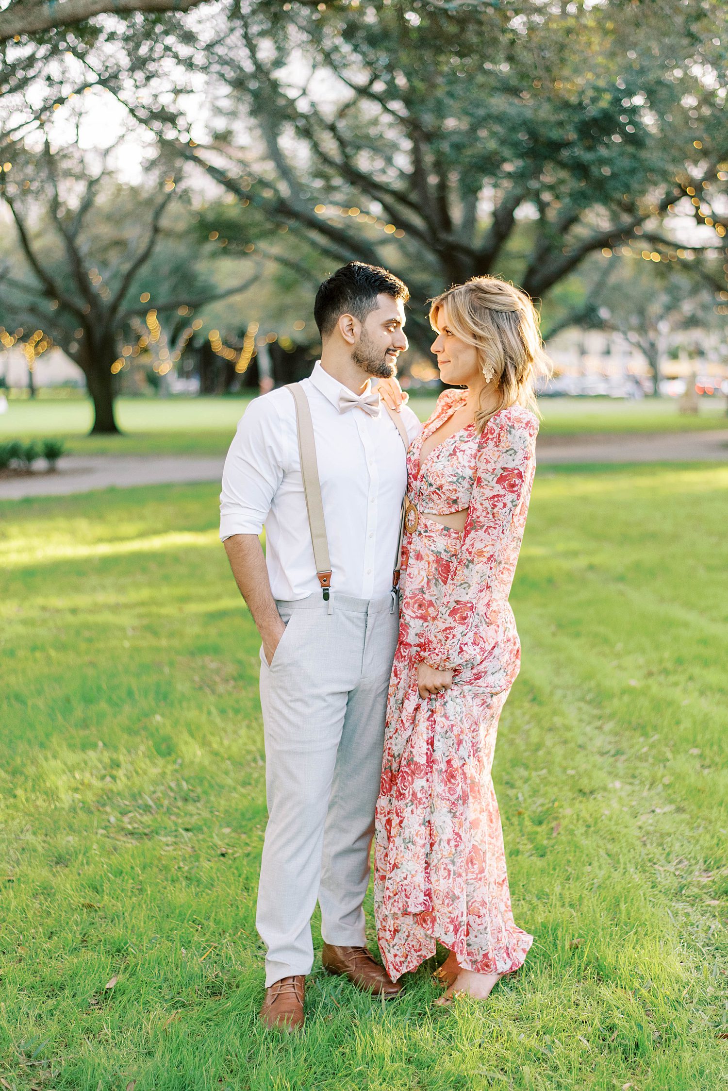 engaged couple hugs in park during Tampa FL engagement photos