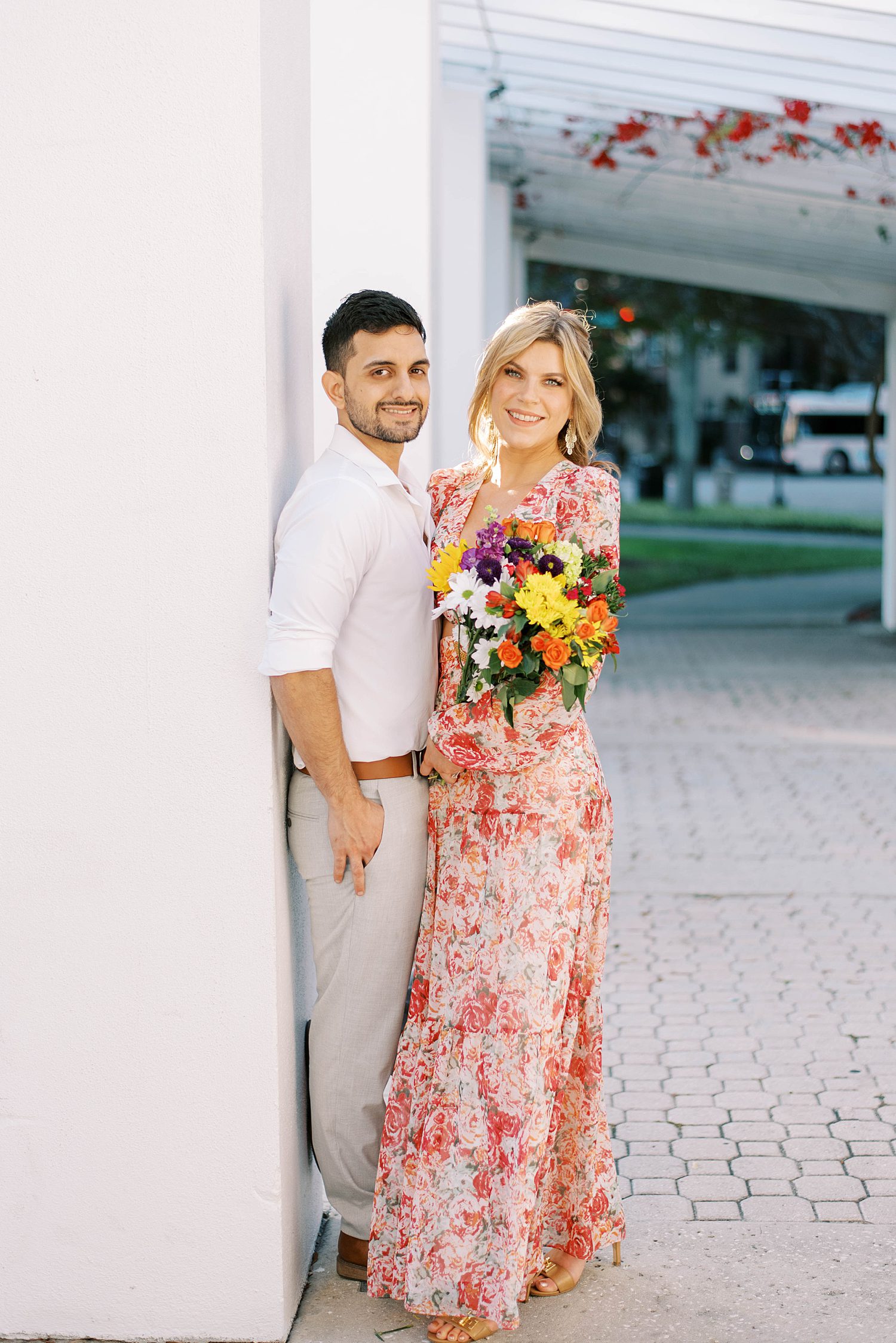 bride holds colorful bouquet for Tampa FL engagement photos