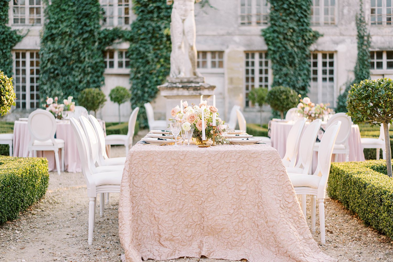 reception table with rose gold table cloth at Chateau de Villette