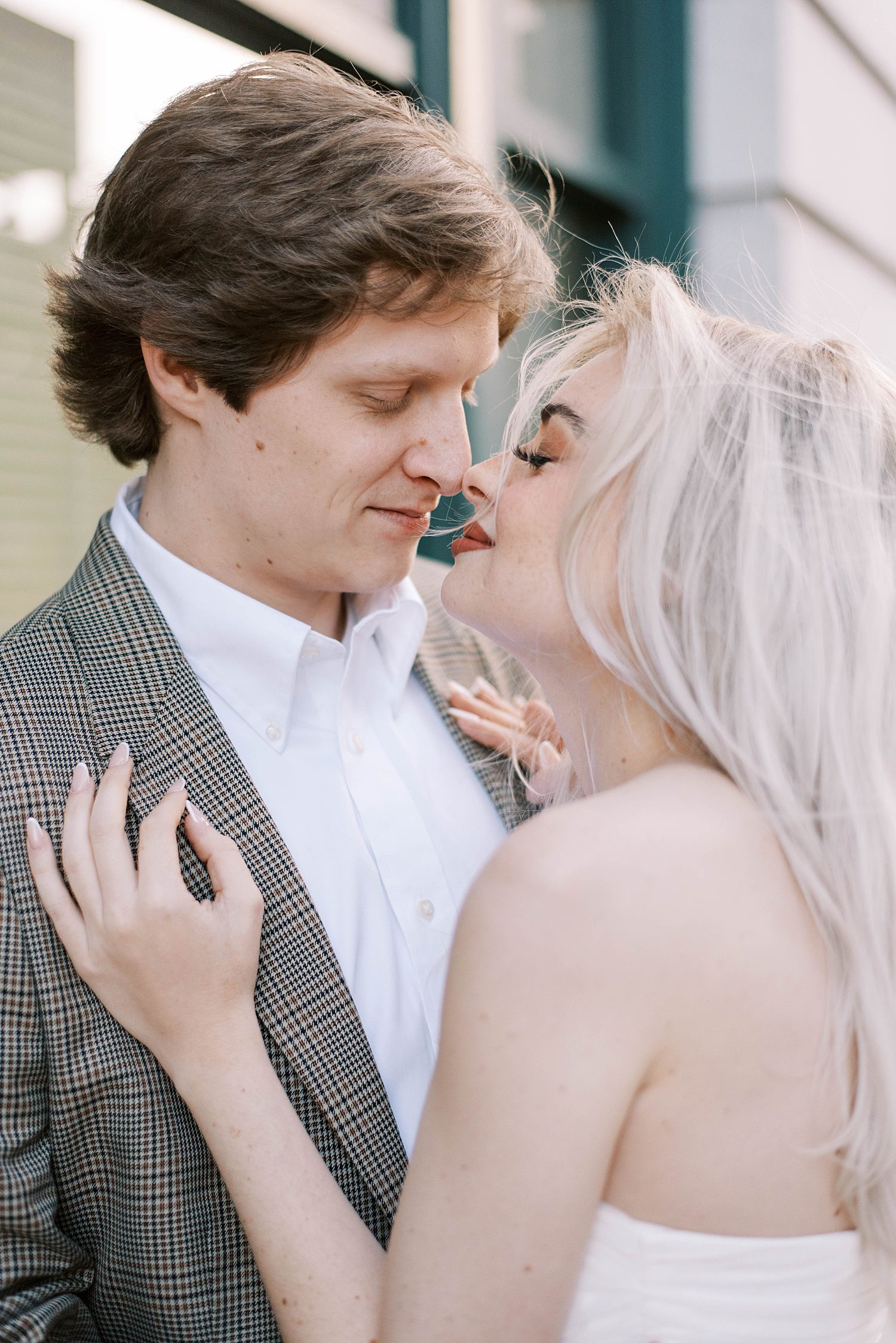 bride leans in for kiss during downtown Tampa engagement session