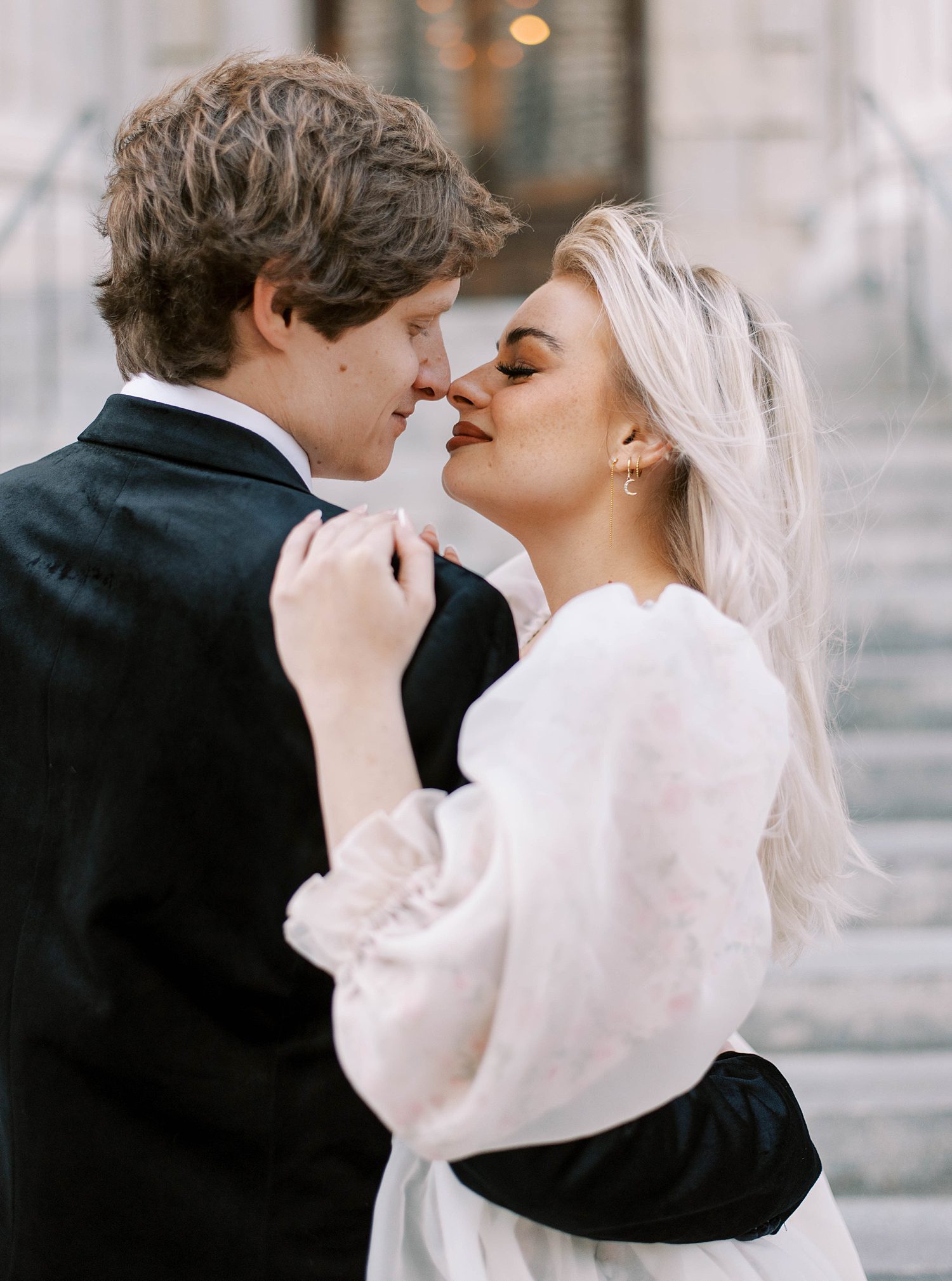 couple hugs outside City hall during downtown Tampa engagement session