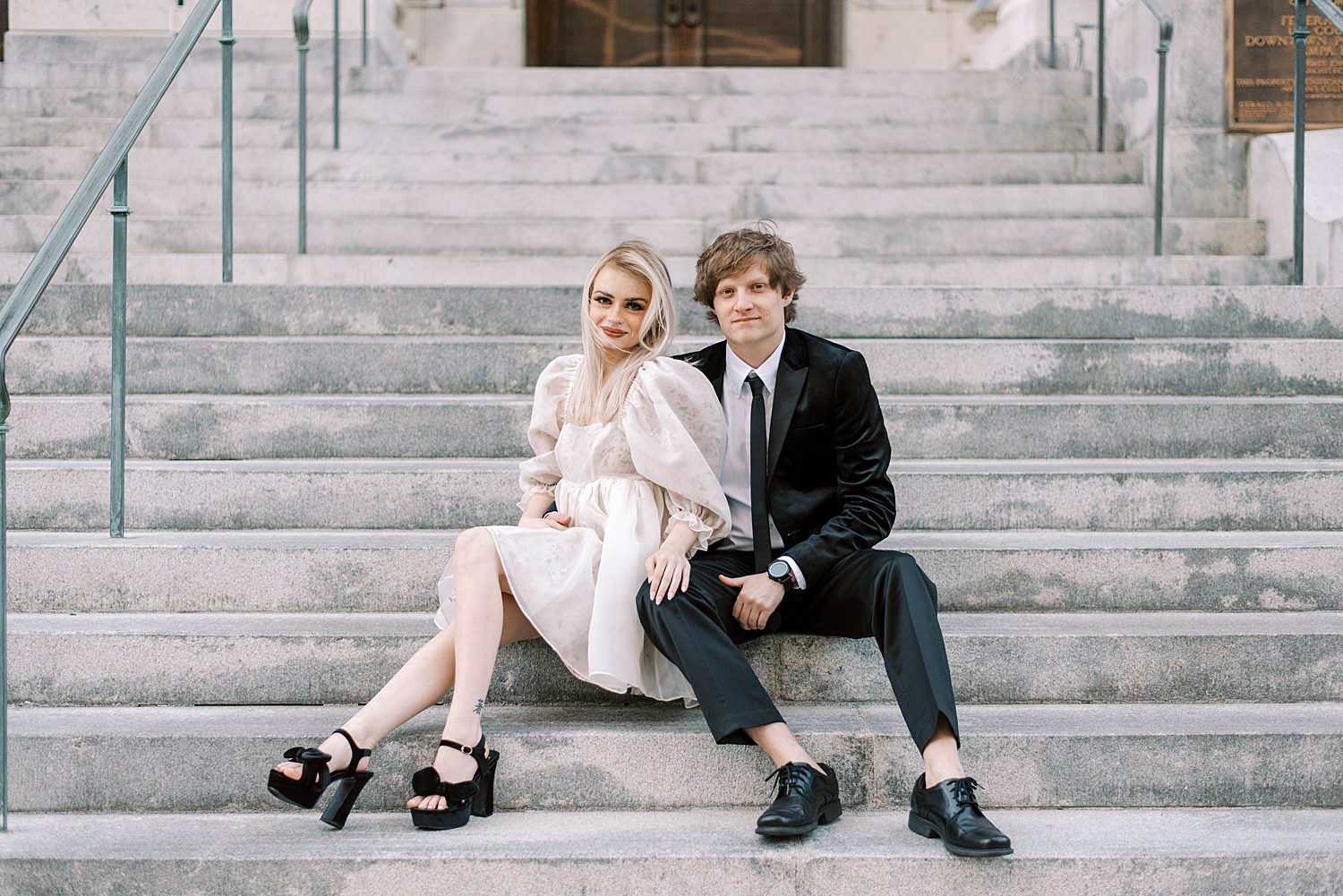 couple sits on steps of City Hall in Tampa FL
