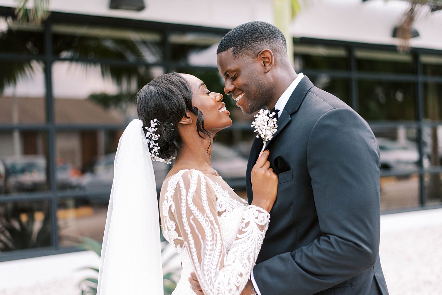 couple leans in for kiss during Florida wedding portraits 