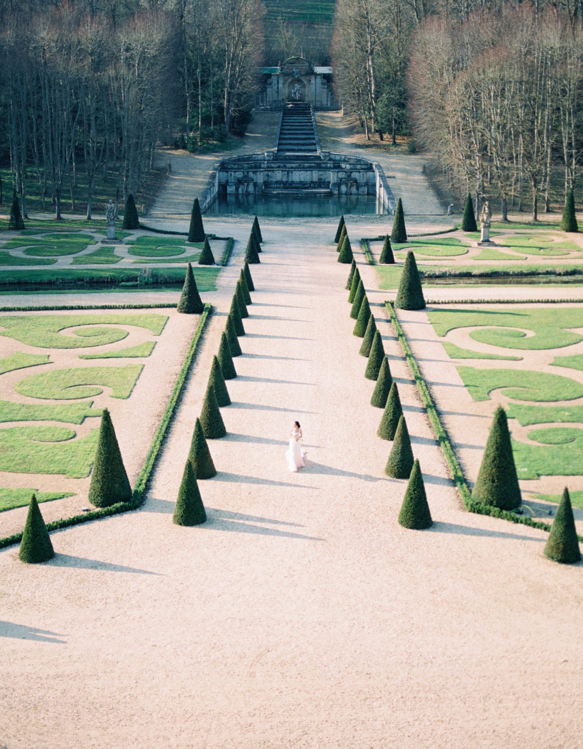 Chateau de Villette Wedding Photographer Paris Wedding Photographer Bride walking around french gardens