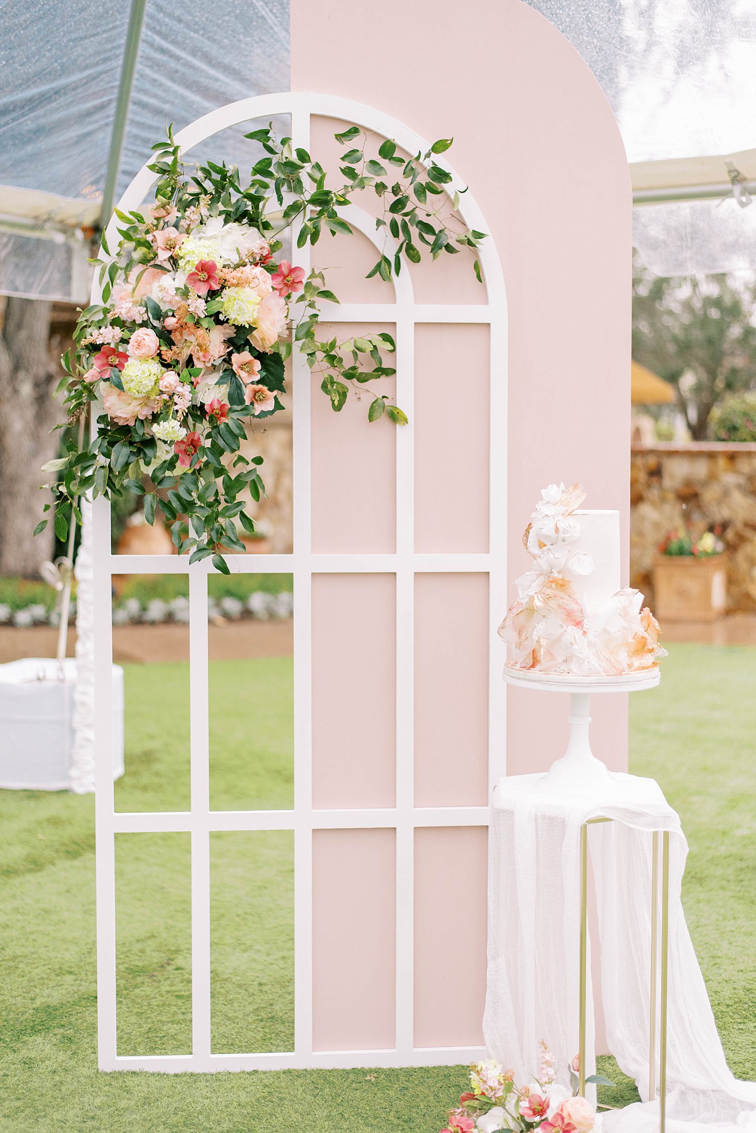 white arbor with pink and white flowers