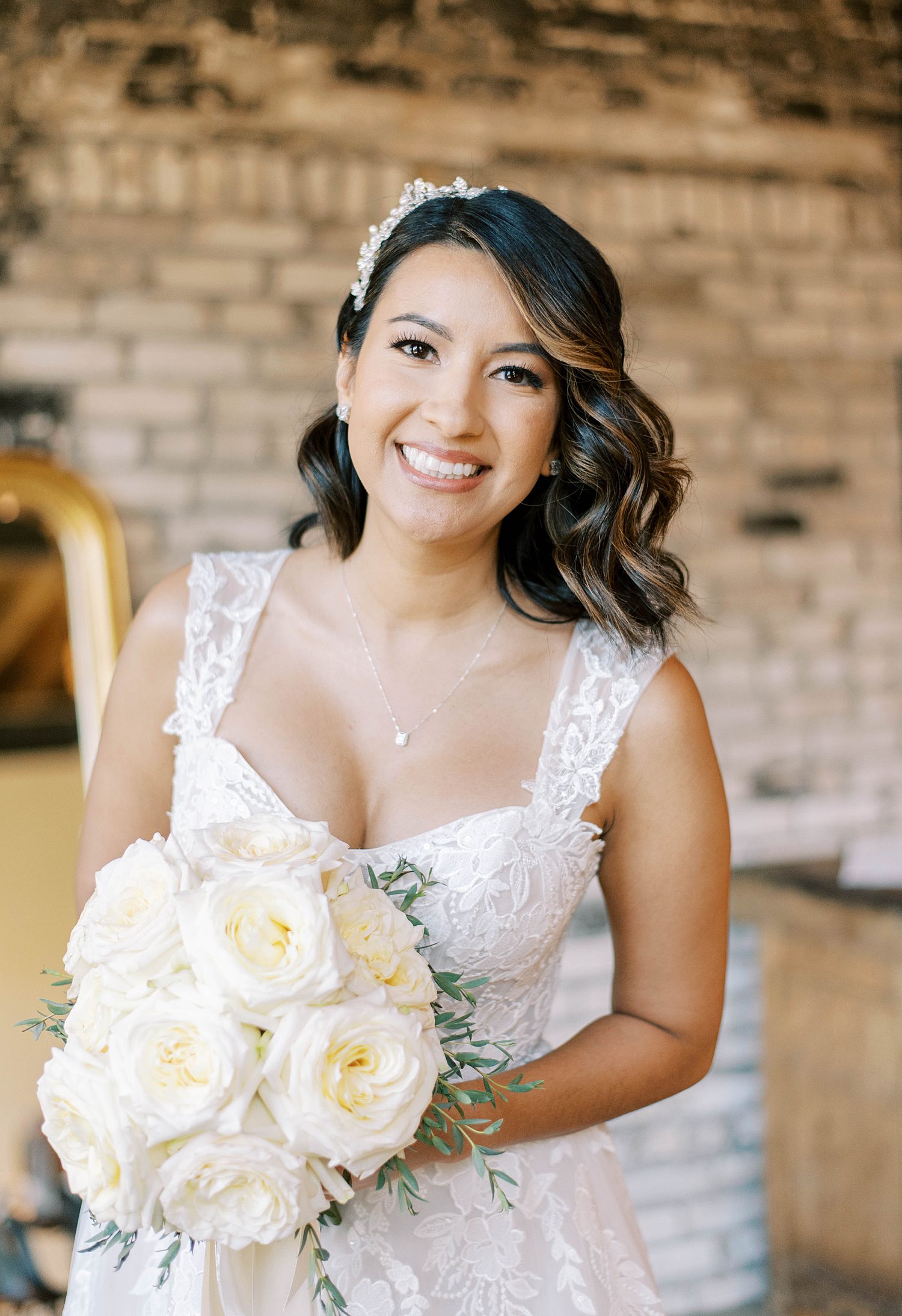 bride smiles with hair swept to one side of head