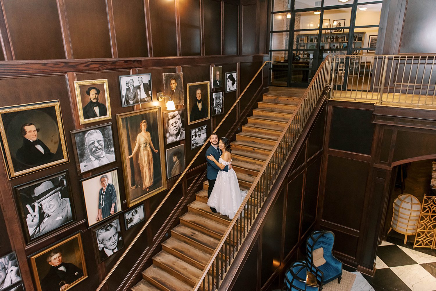 bride and groom pose on staircase inside Tampa FL hotel