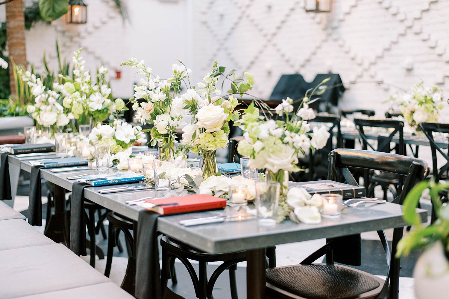 place settings for Oxford Exchange wedding reception with vintage books