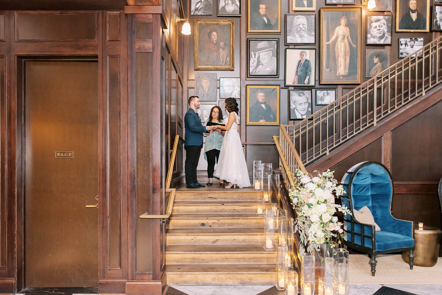 newlyweds exchange vows on staircase at Oxford Exchange