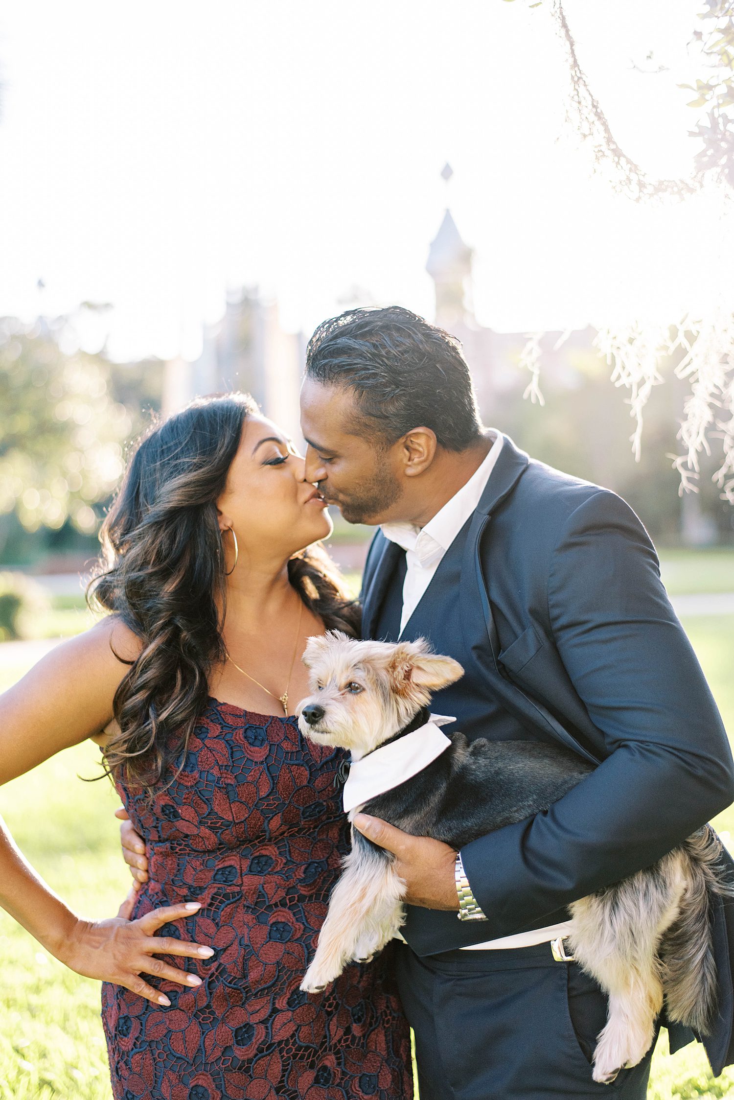 engaged couple kisses at University of Tampa