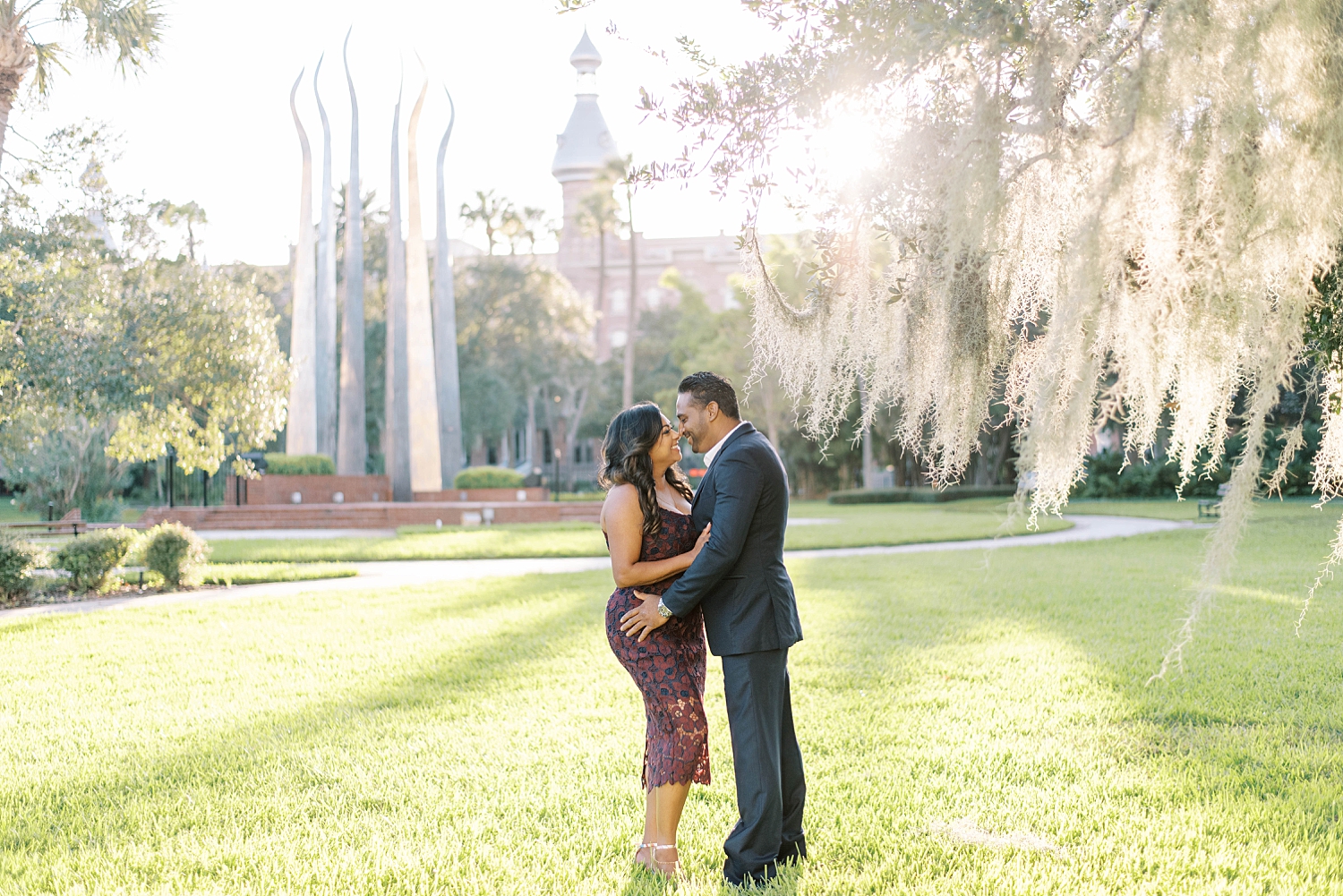 engaged couple hugs on University of Tampa campus
