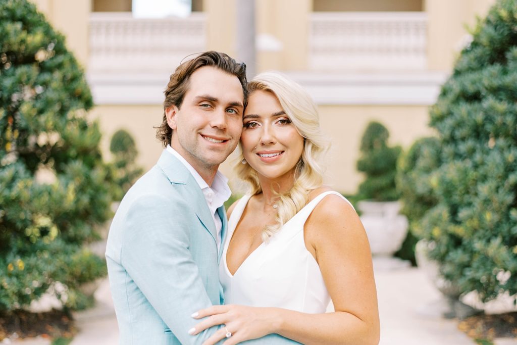 bride and groom hug outside the Ritz Carlton Sarasota