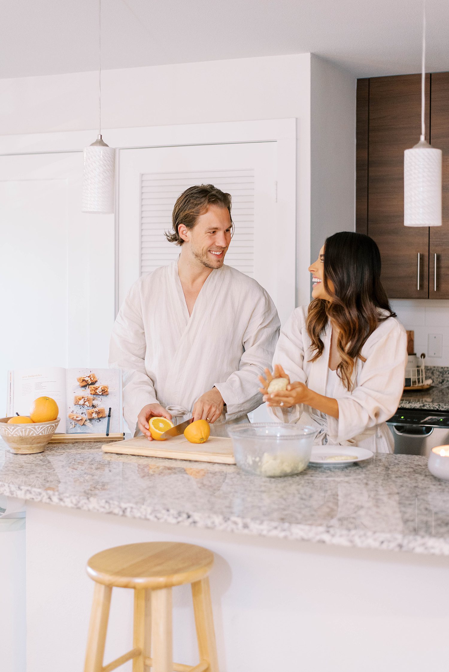 couple cooks in St. Pete home during lifestyle portraits