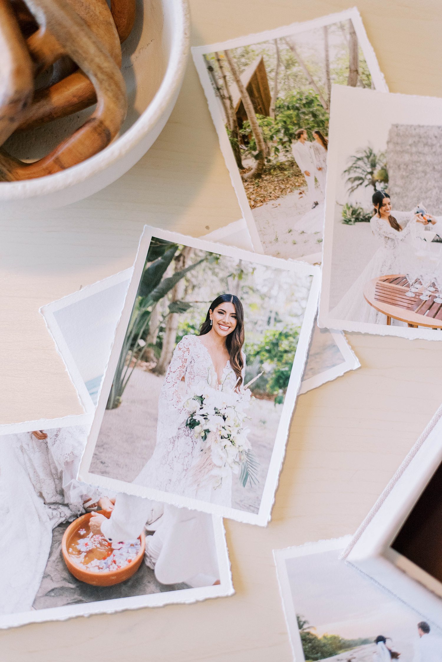 prints from wedding day lay on table in St. Pete Beach home