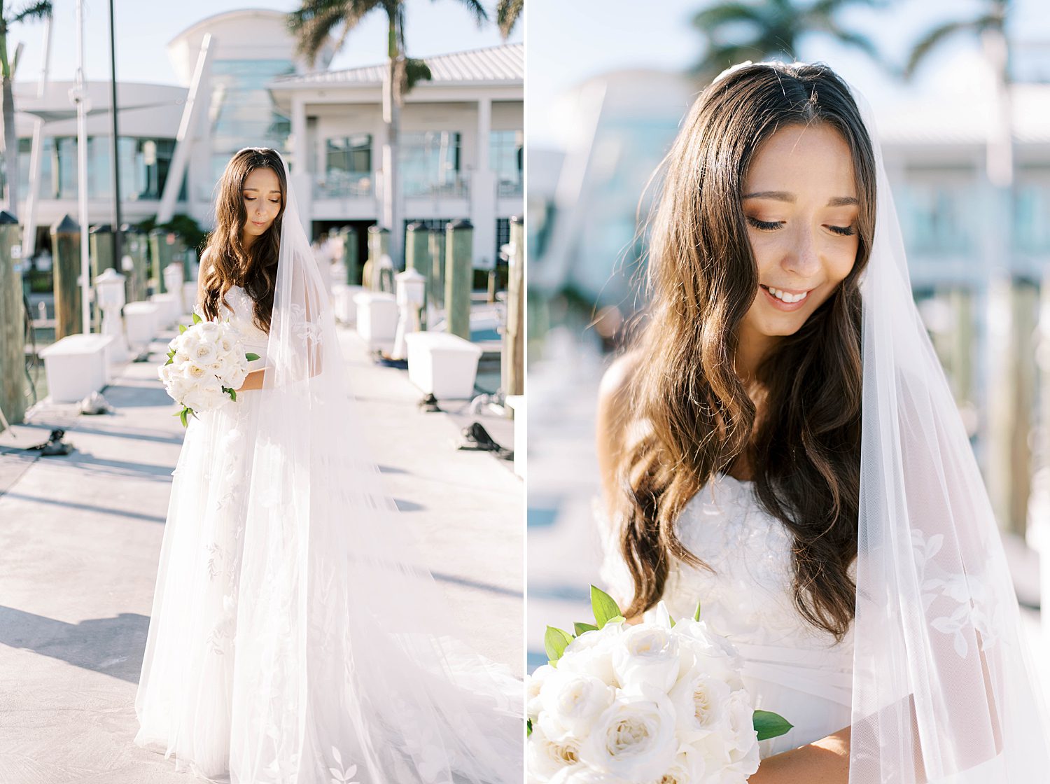 bride holds bouquet of white flowers looking over shoulder standing on wooden dock