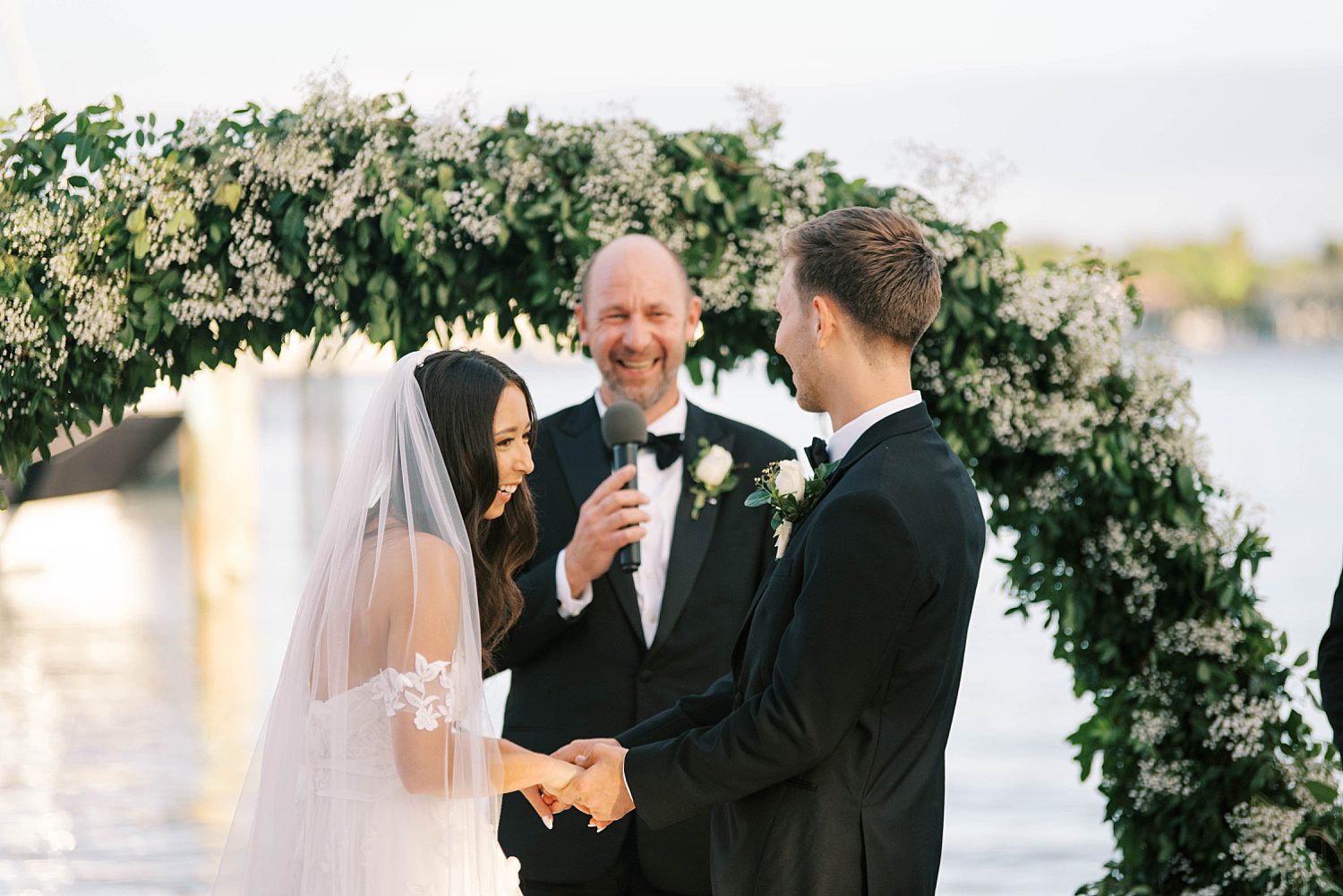 bride and groom exchange vows at Sarasota Yacht Club