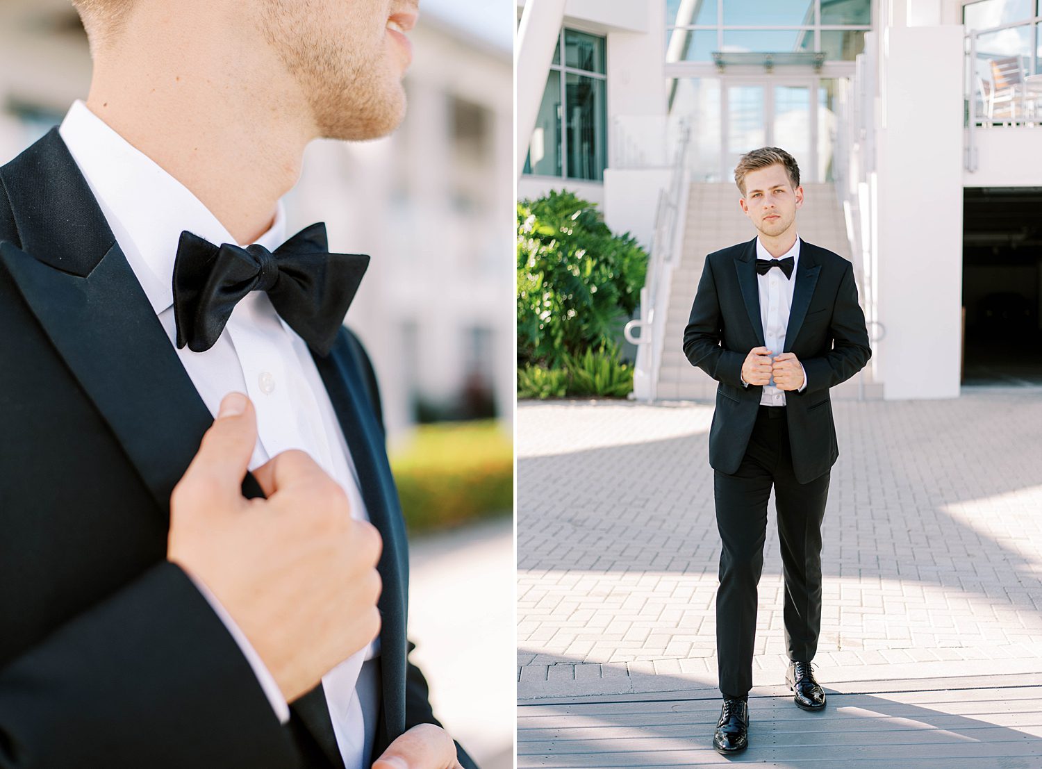 groom stands in classic black suit with bowtie holding lapel