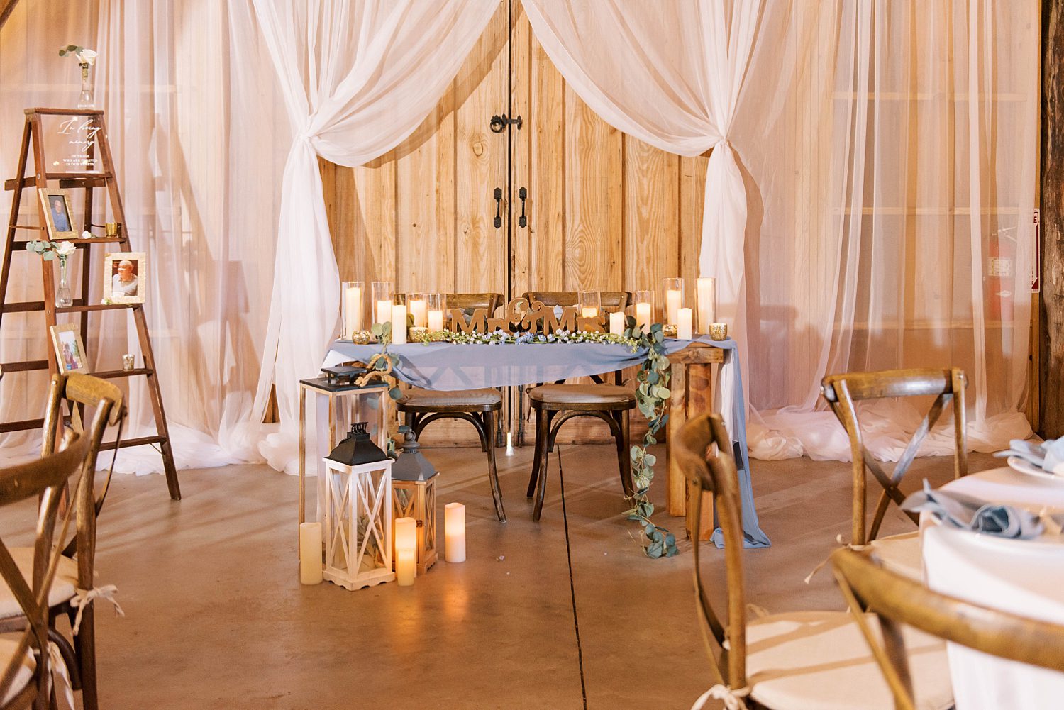 rustic wedding reception sweetheart table at The Barn at Lone Oak Acres