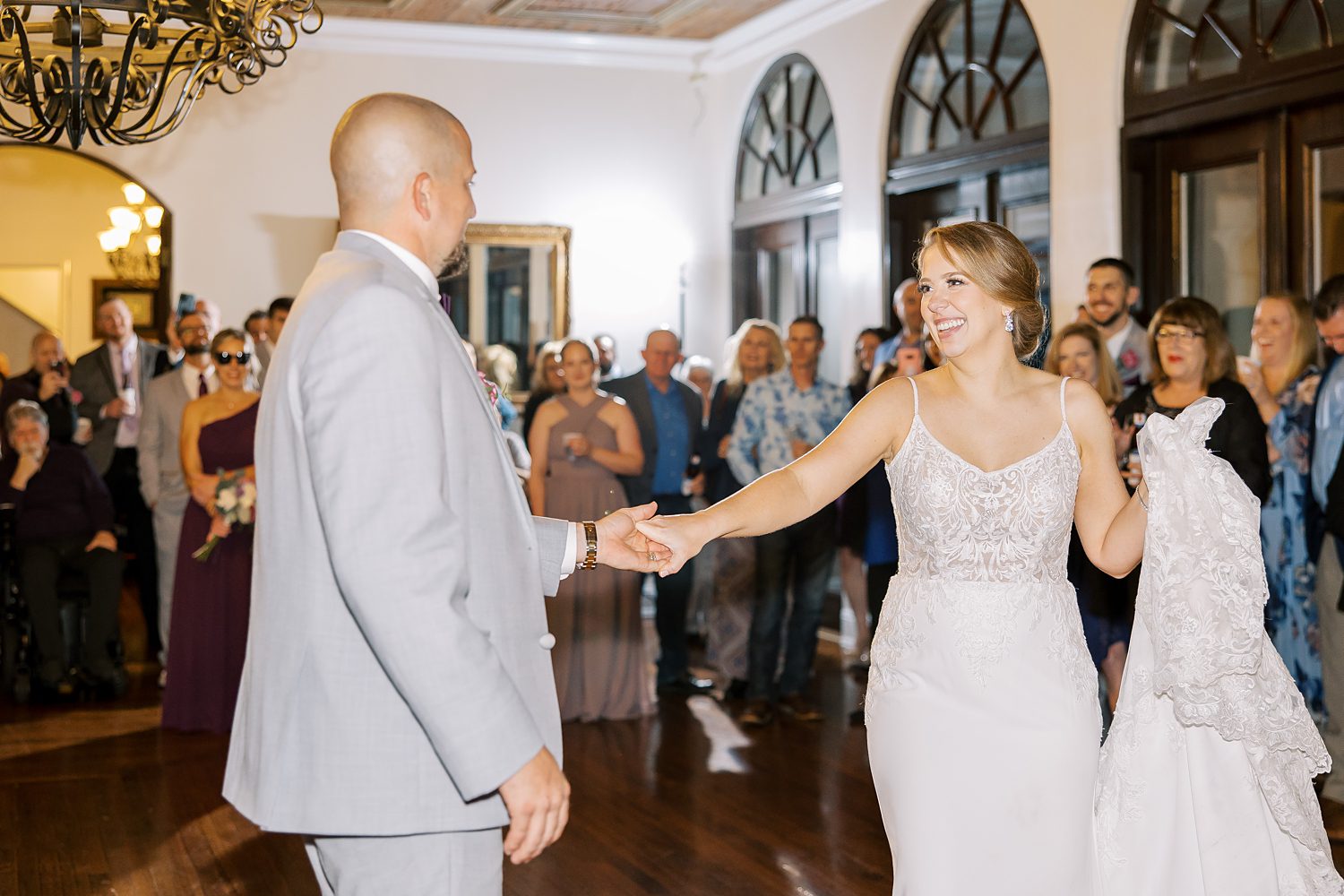 groom twirls bride during FL wedding reception