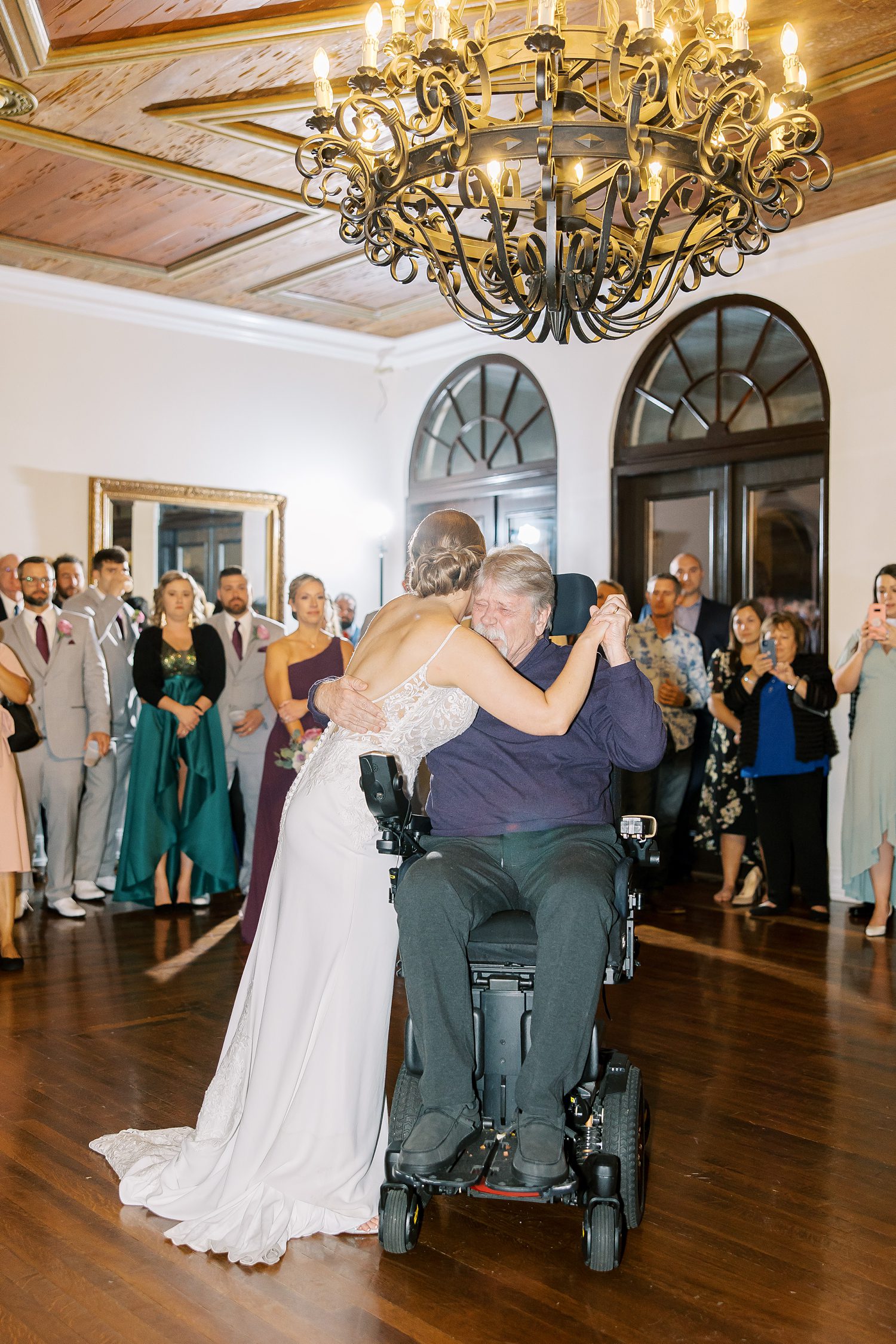 bride dances with father in wheelchair