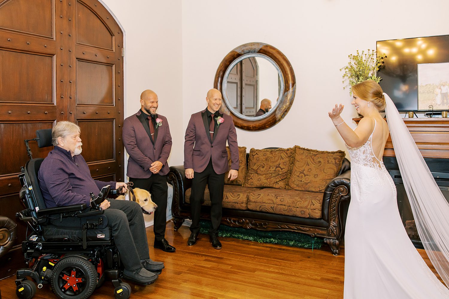 bride approaches father and grandfather in wheelchair for first look