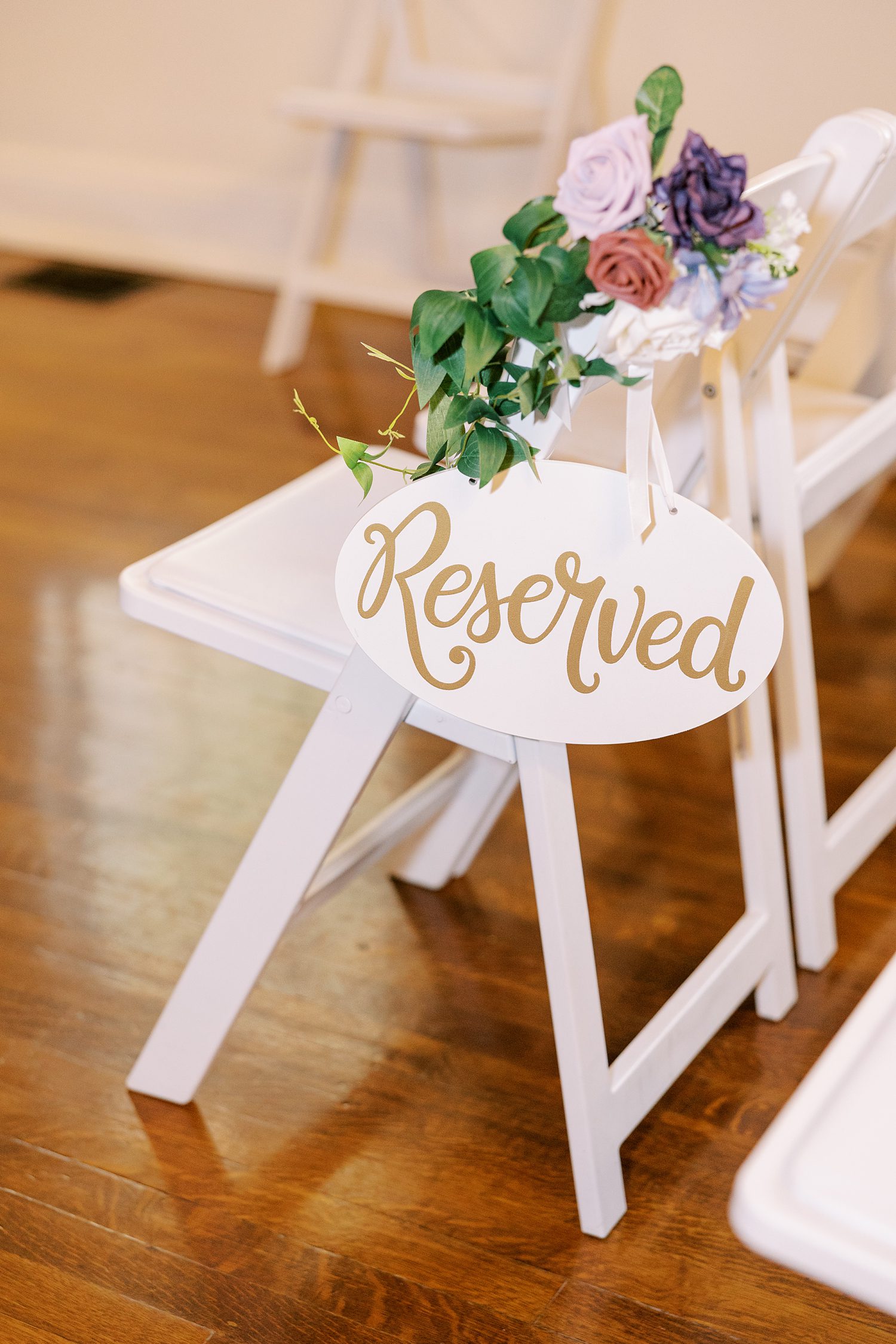 reserved sign sits on white chair at Bella Cosa Lakeside