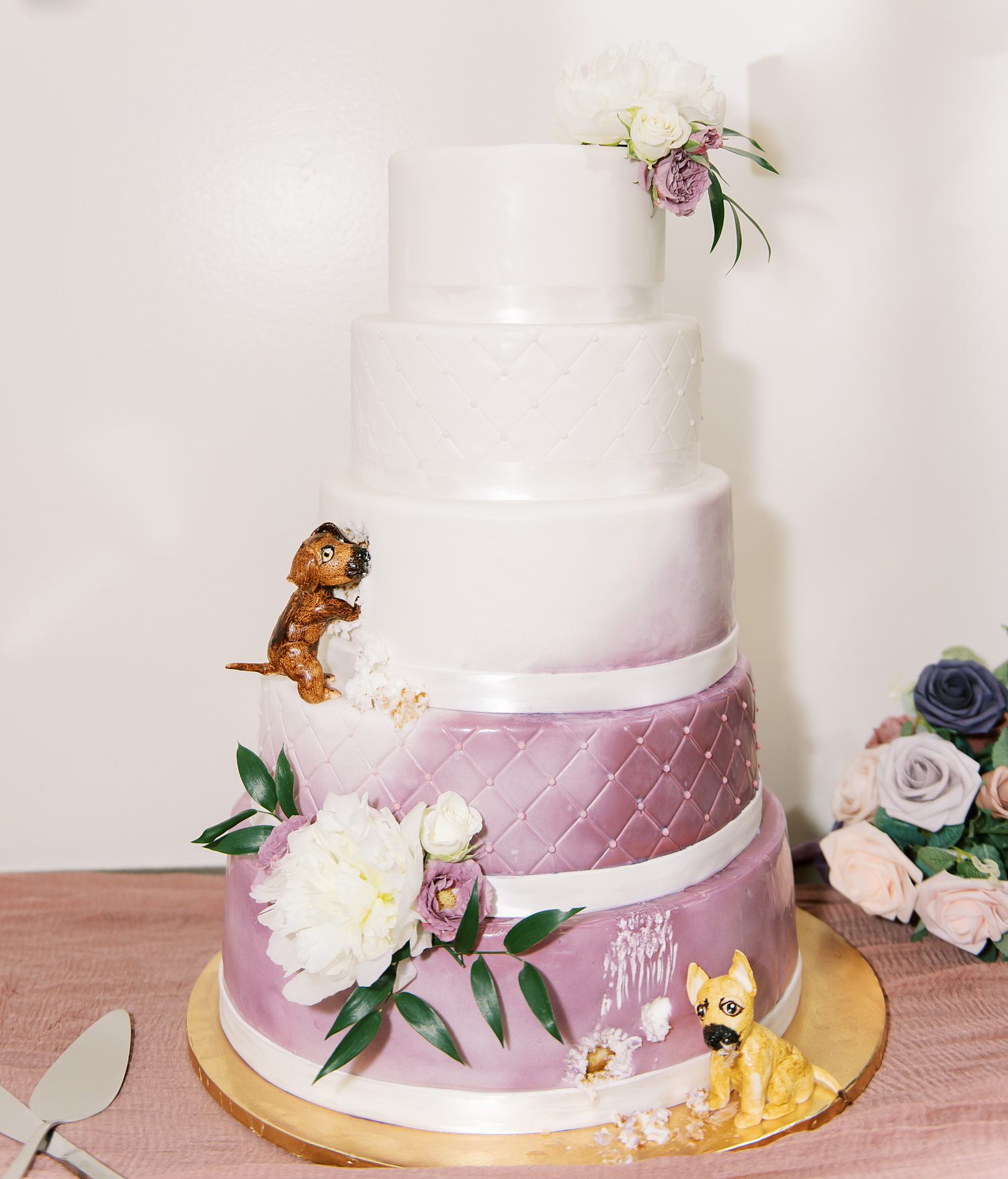 tiered wedding cake with fondant dogs
