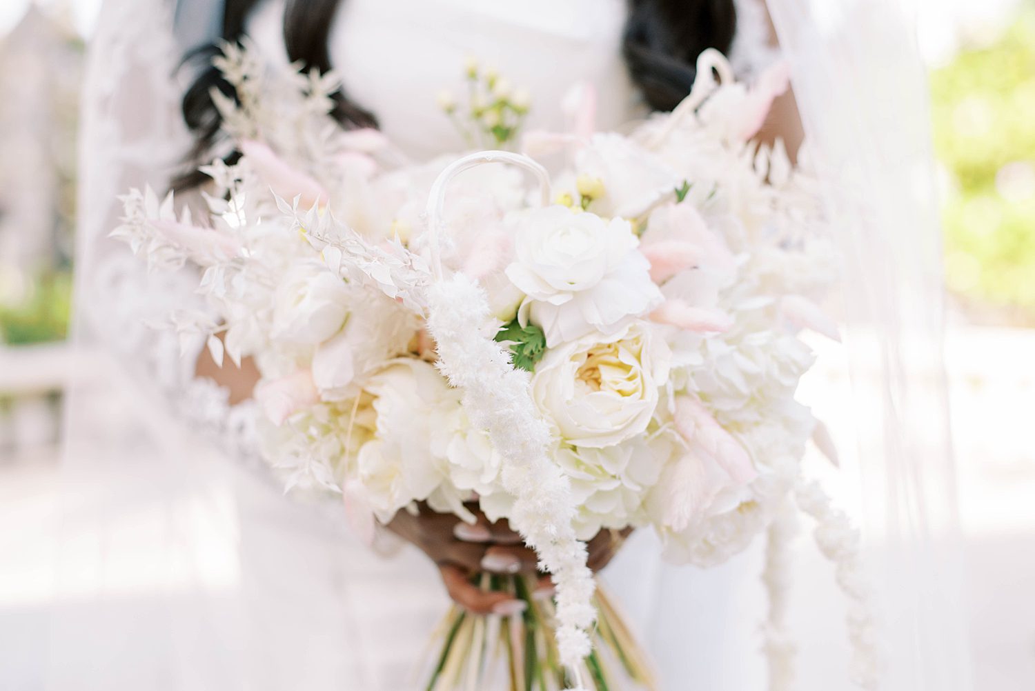 bride's winter bouquet with pink and white flowers