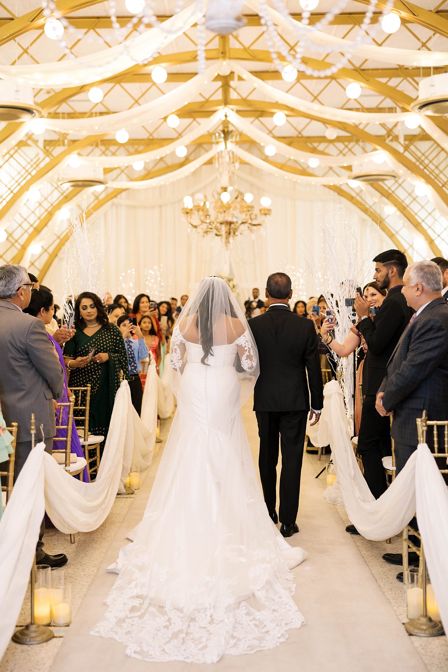bride and father walk down aisle at Kapok Special Events