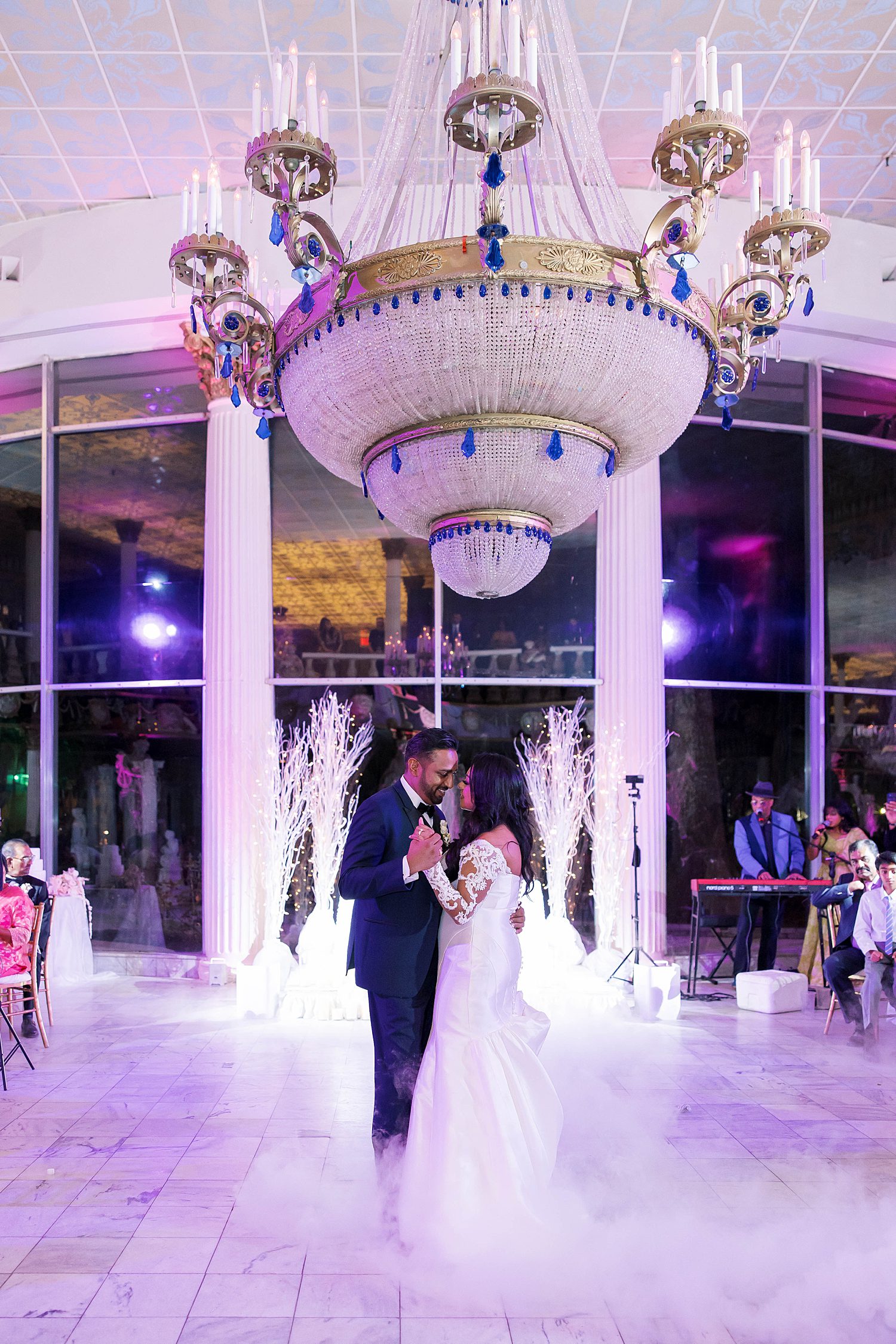 bride and groom dance in fog during first dance at Kapok Special Events