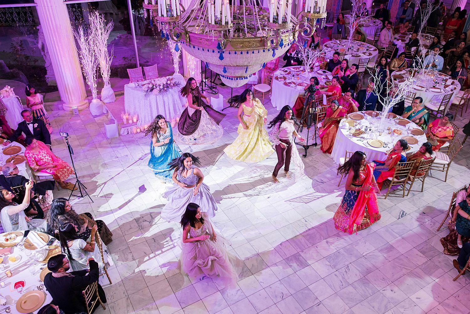 bridesmaids do traditional Indian dance during reception