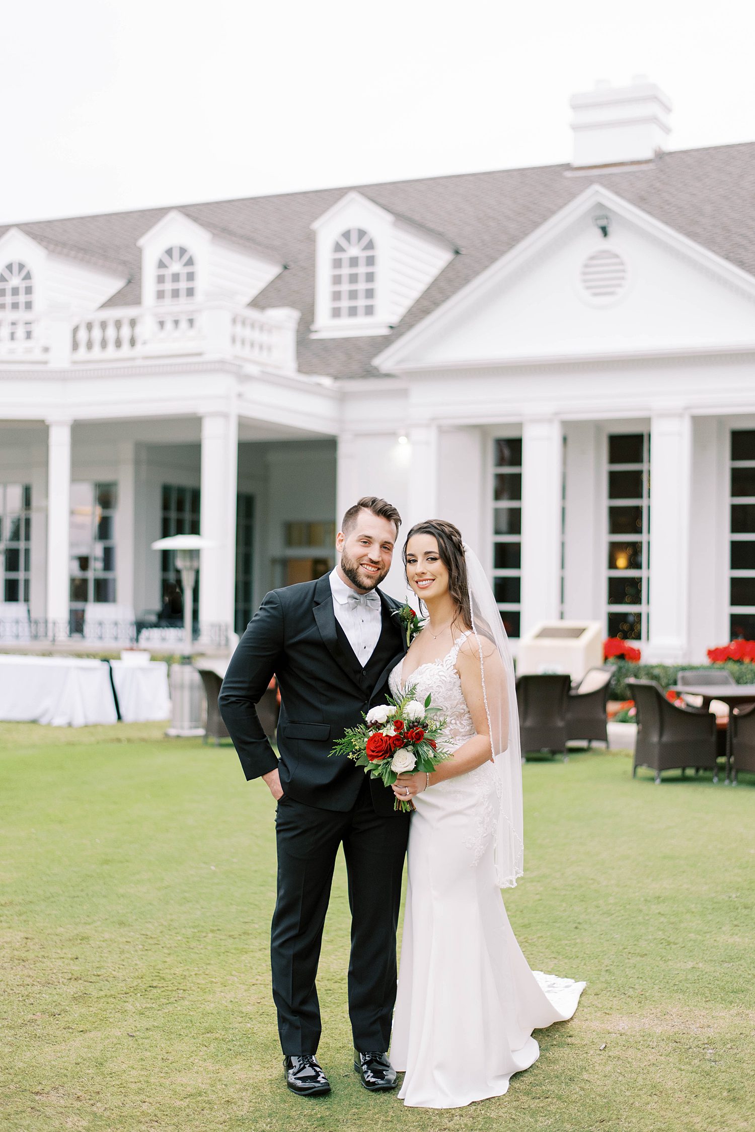 bride and groom stand on lawn at Palma Ceia Country Club