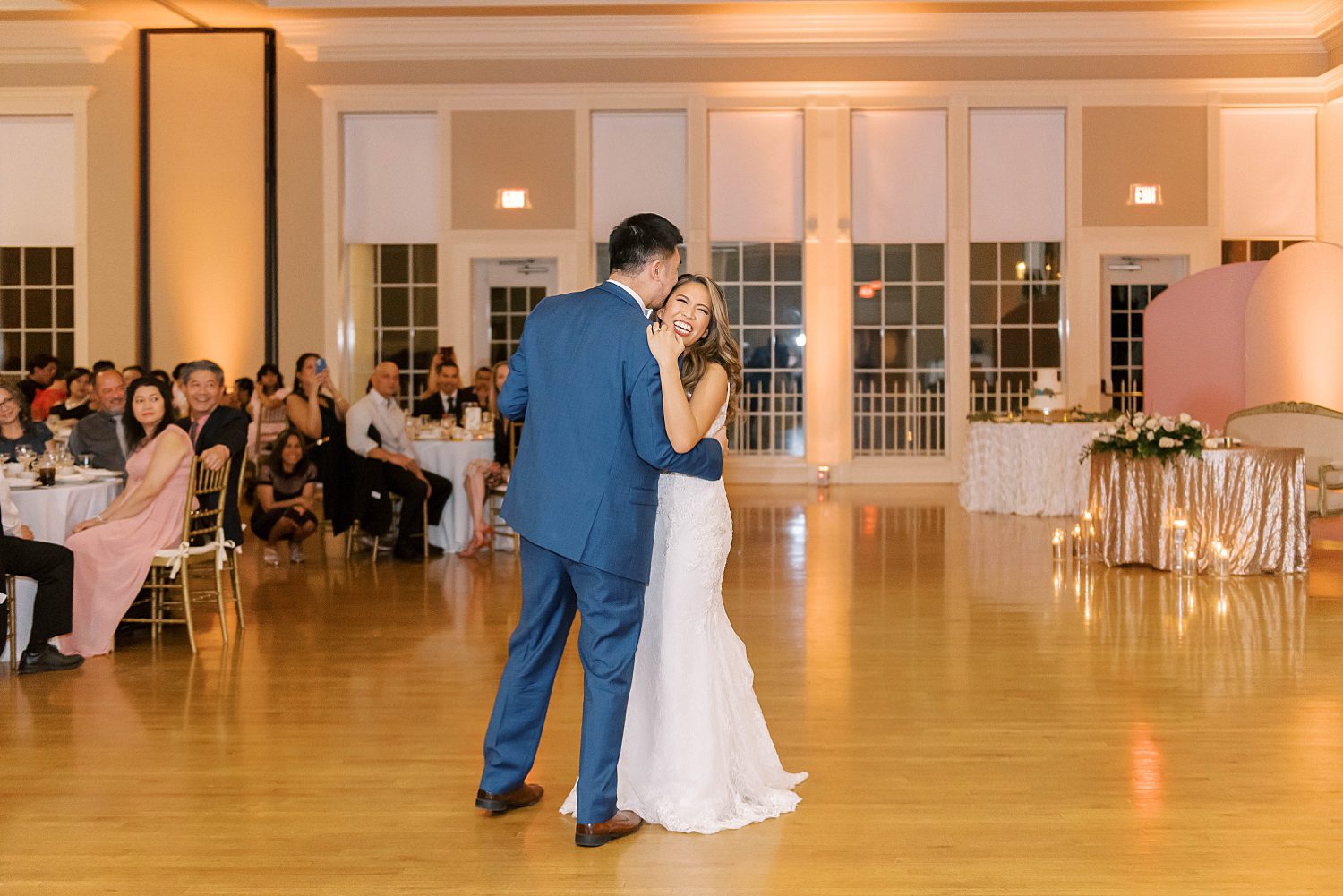 bride and groom dance together at Higgins Hall